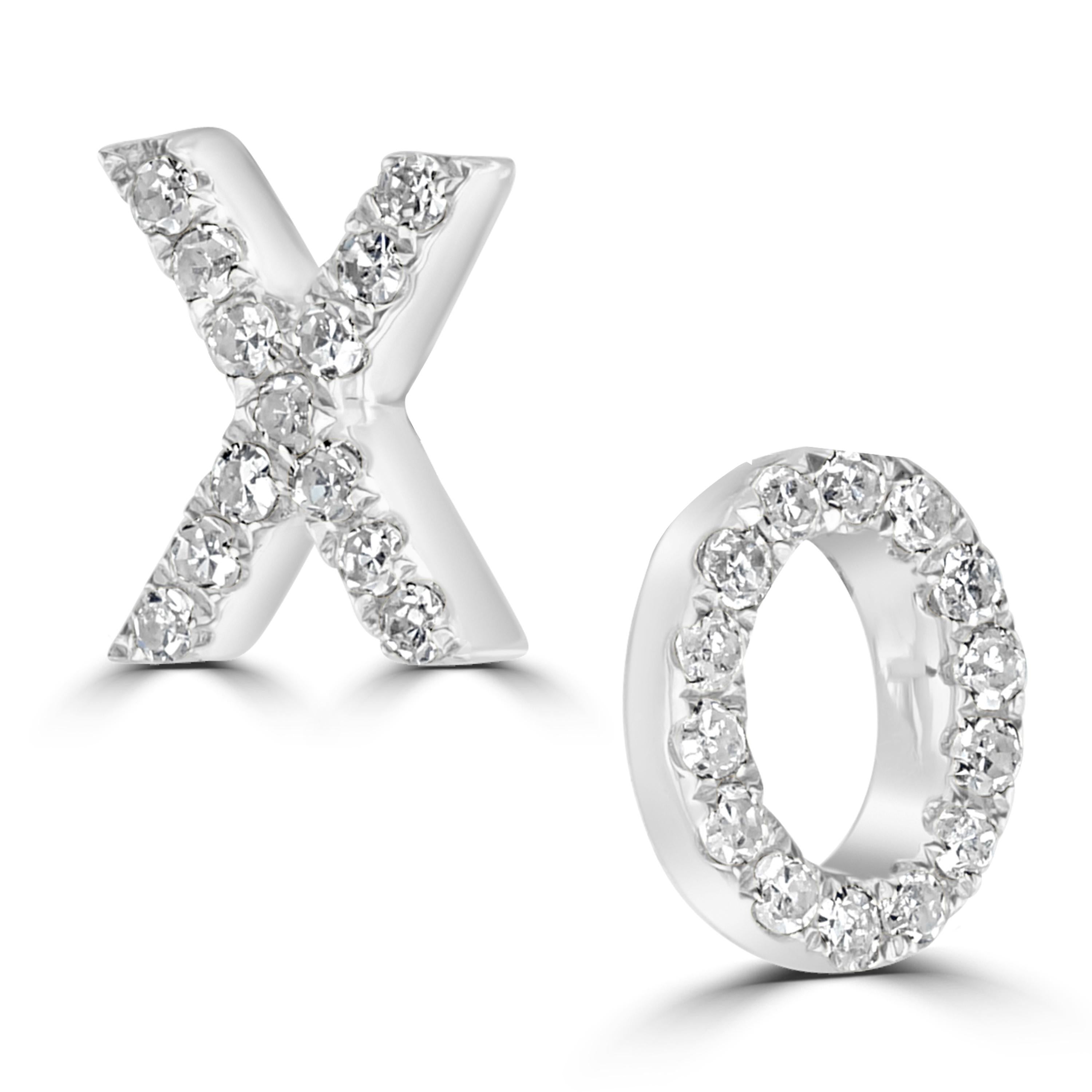 A unique but chic addition to your wardrobe. These fashionable X O studs are studded with 27 round diamonds in pave. They come with gold posts and clutch backs.