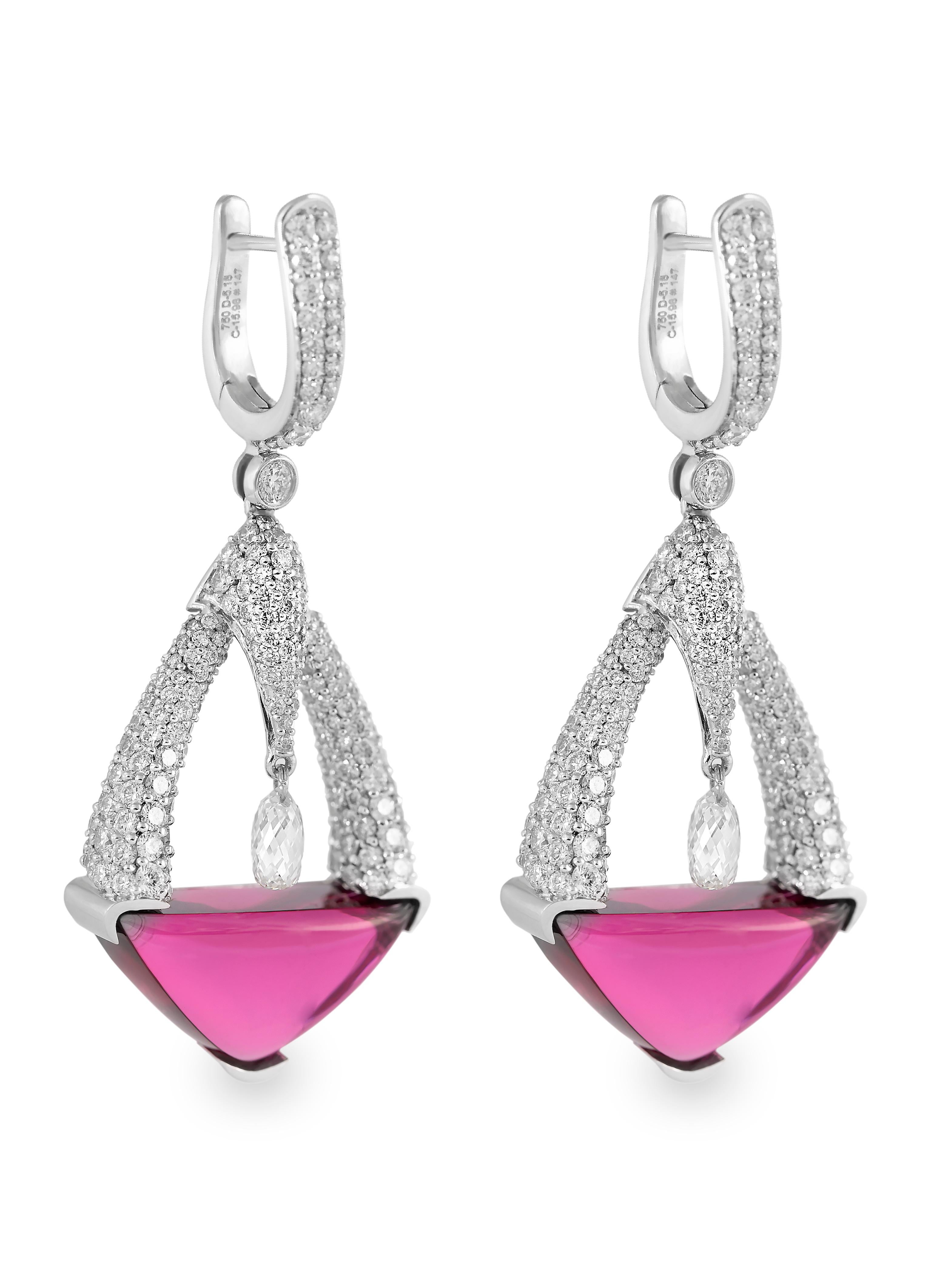 These stunning earrings in 18 karat white gold by Atelo contain diamond briolettes that delicately dangle above two magnificent, triangular rubelites.

The diamonds briolettes are set so that they “dance” over the rubelites. Elegant, diamond-set
