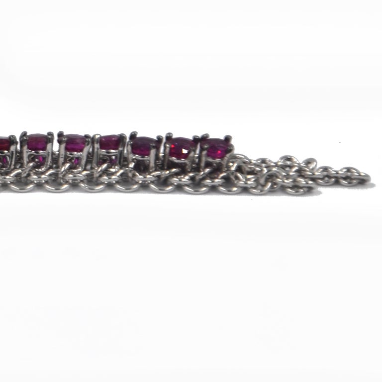18KT White Gold RUBIES  Garavelli Long Earrings. 
A soft hand made gold mesh with a line of rubies, lenght 7.5 cm 
18 kt GOLD gr  : 12.00
RUBIES ct  : 3,72
They can be done in blue sapphires, white diamonds, brown diamonds  too.
