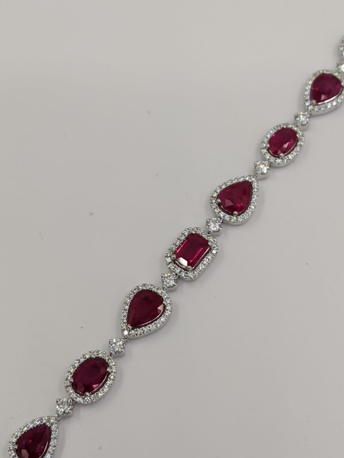 18 Karat White Gold Ruby and Diamond Bracelet
2.61 Carats of Diamonds
11.73 Carats of Rubies
Assortment of shapes and cuts: pear, round, oval, heart
18 Karat White Gold
