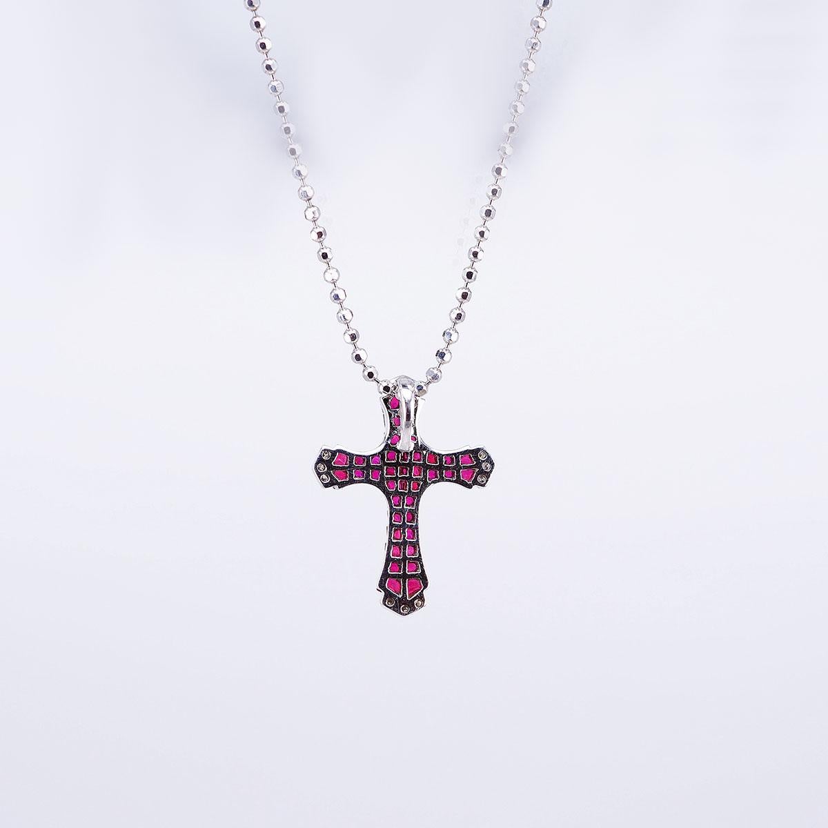 We design a very nice cross pendant.The technique  use invisible setting .We cut and groove very stone. This pendant is very nice style you can use in many occasion in day time and evening time for party.  Ruby use 3.05 ct, Diamond 0.05 ct G VS ,the