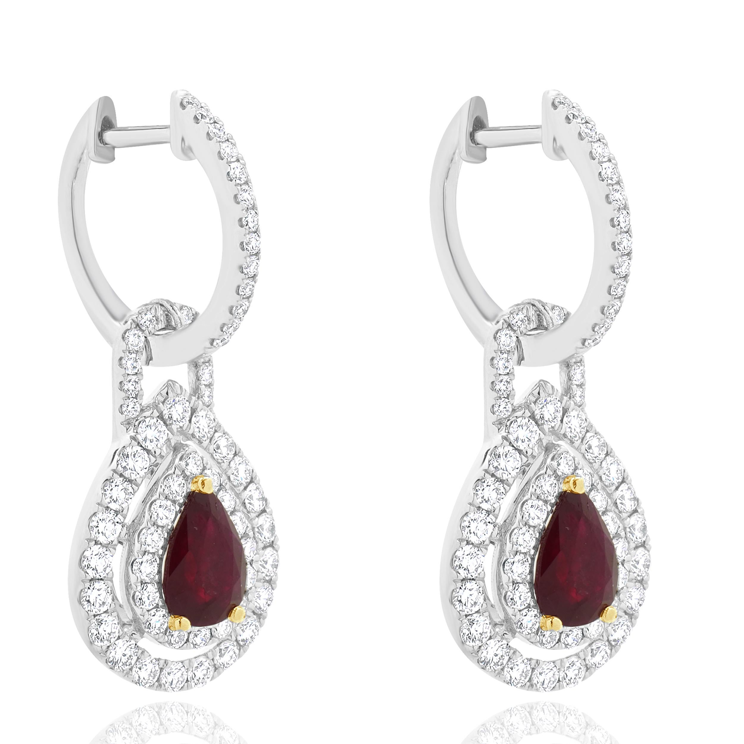 Designer: custom
Material: 18K white gold
Rubies: 2 pear cut = 1.81cttw
Diamond: 1.31cttw
Color: G
Clarity:SI1
Weight: 6.81 grams
