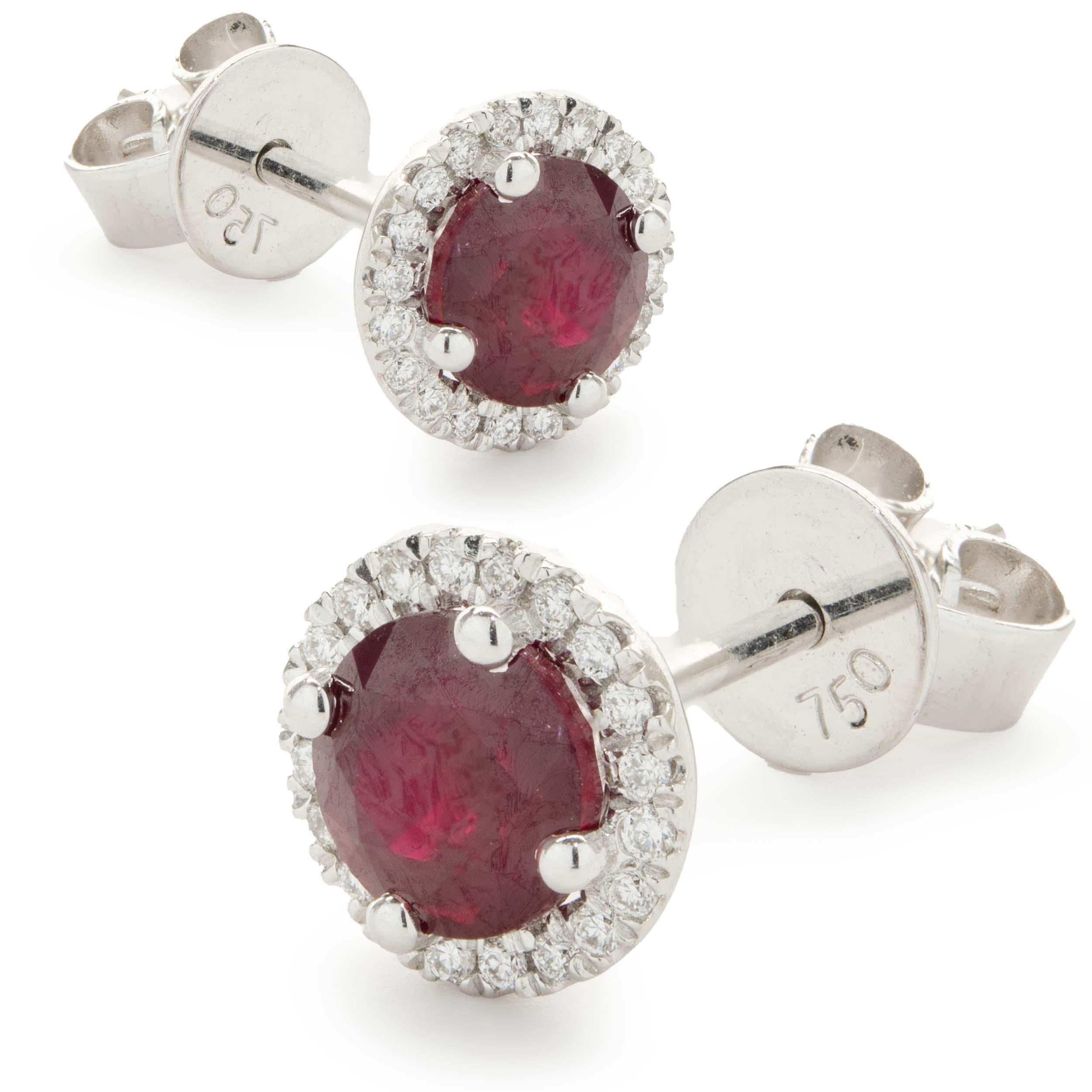 Designer: custom
Material: 18K white gold
Diamond: 40 round brilliant cut = 0.09cttw
Color: G
Clarity: SI1
Ruby: 2 round cut = 1.27ct
Dimensions: earrings measure 7.19mm in length 
Fastenings: friction backs
Weight: 1.90 grams
