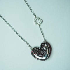 18 Carat White Gold Ruby and Diamond Heart Pendant in Invisible Setting