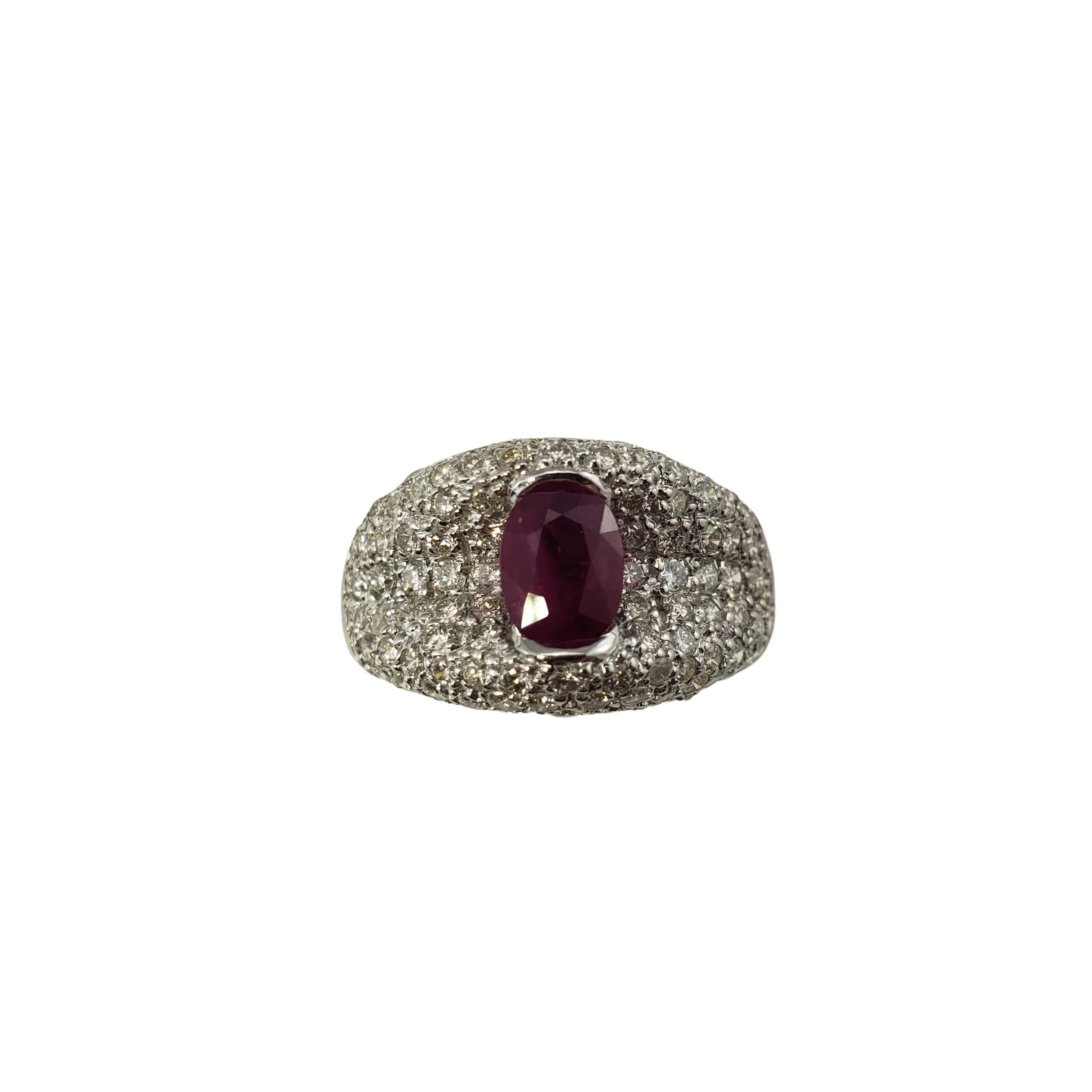 18 Karat White Gold Ruby and Diamond Ring Size 6.75 GAI Certified-

This stunning ring features one oval ruby (7 mm x 5 mm) and 106 round brilliant cut diamonds set in beautifully detailed 18K white gold.  Width: 12 mm.  Shank:  4 mm.  Height: 8