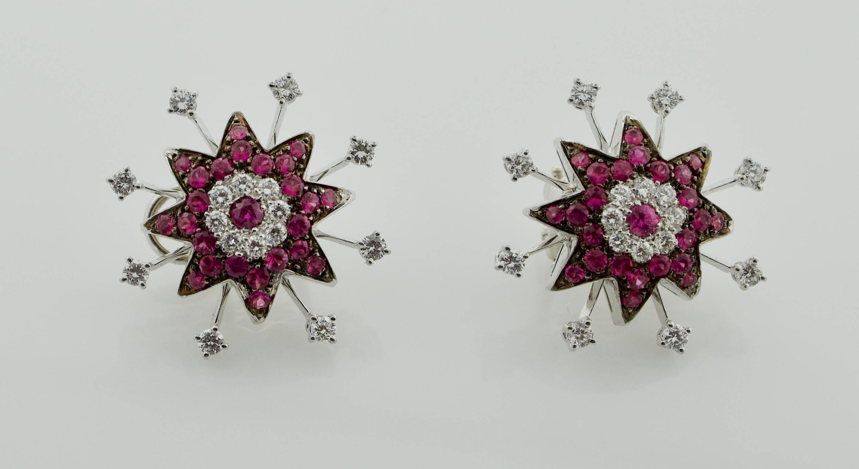 18k White Gold Ruby and Diamond Starburst Earrings
Thirty Two Round Brilliant Cut Diamonds weighing 1.40 carats approximately [GH VVS-VS1]
Forty Eight Round Rubies weighing 1.75 carats approximately [bright with no imperfections visible to the naked