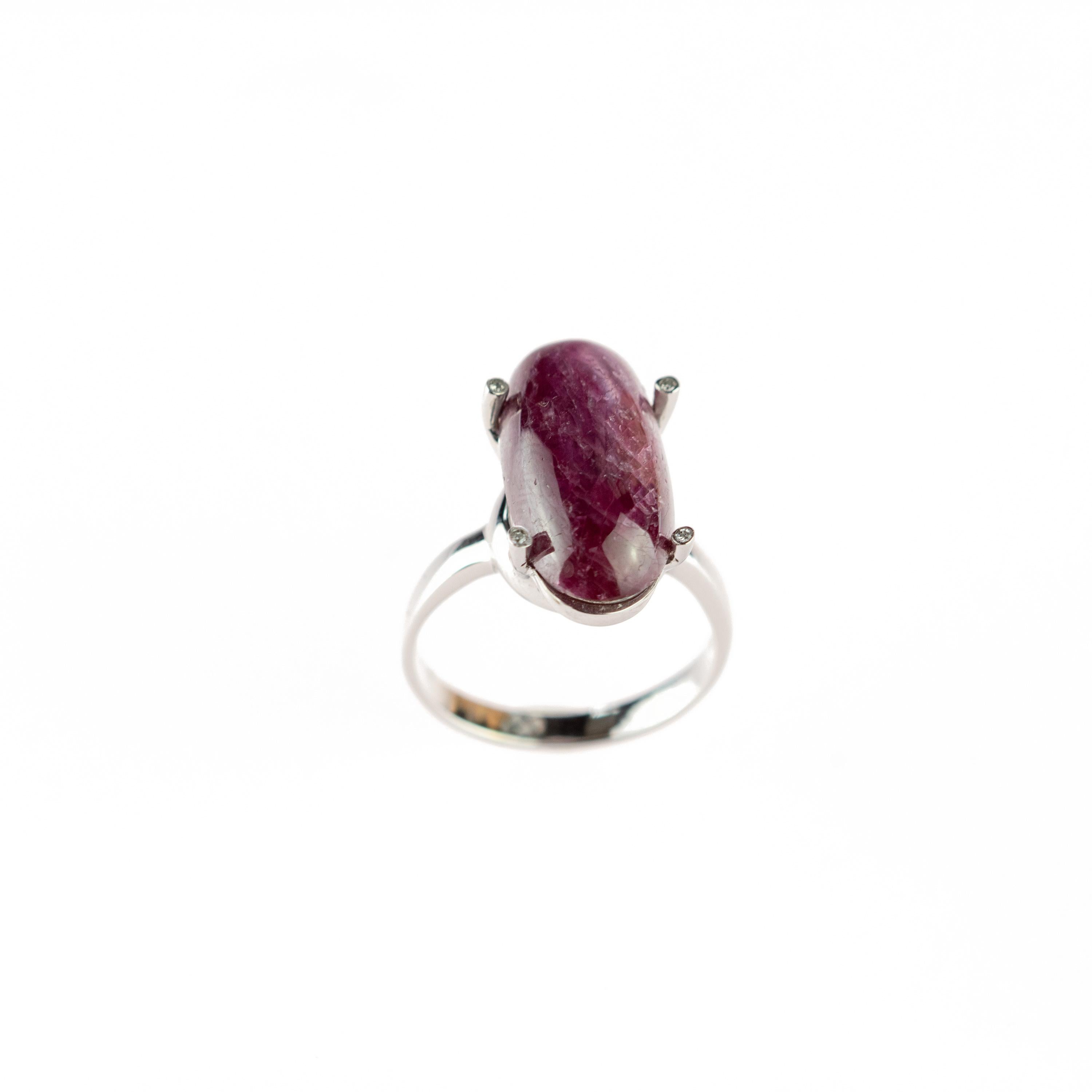 Magnificent 12.5 carats Ruby cabochon oval shaped. Setted in a delicate 18 karat white gold adorned by diamonds that enhance its beauty.
 
This ring is inspired by the power of ruby which provides spiritual vitality and wellness overall. Ancient