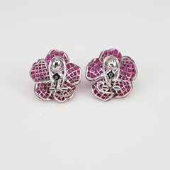18 Carat White Gold Ruby Invisible Flower Earrings