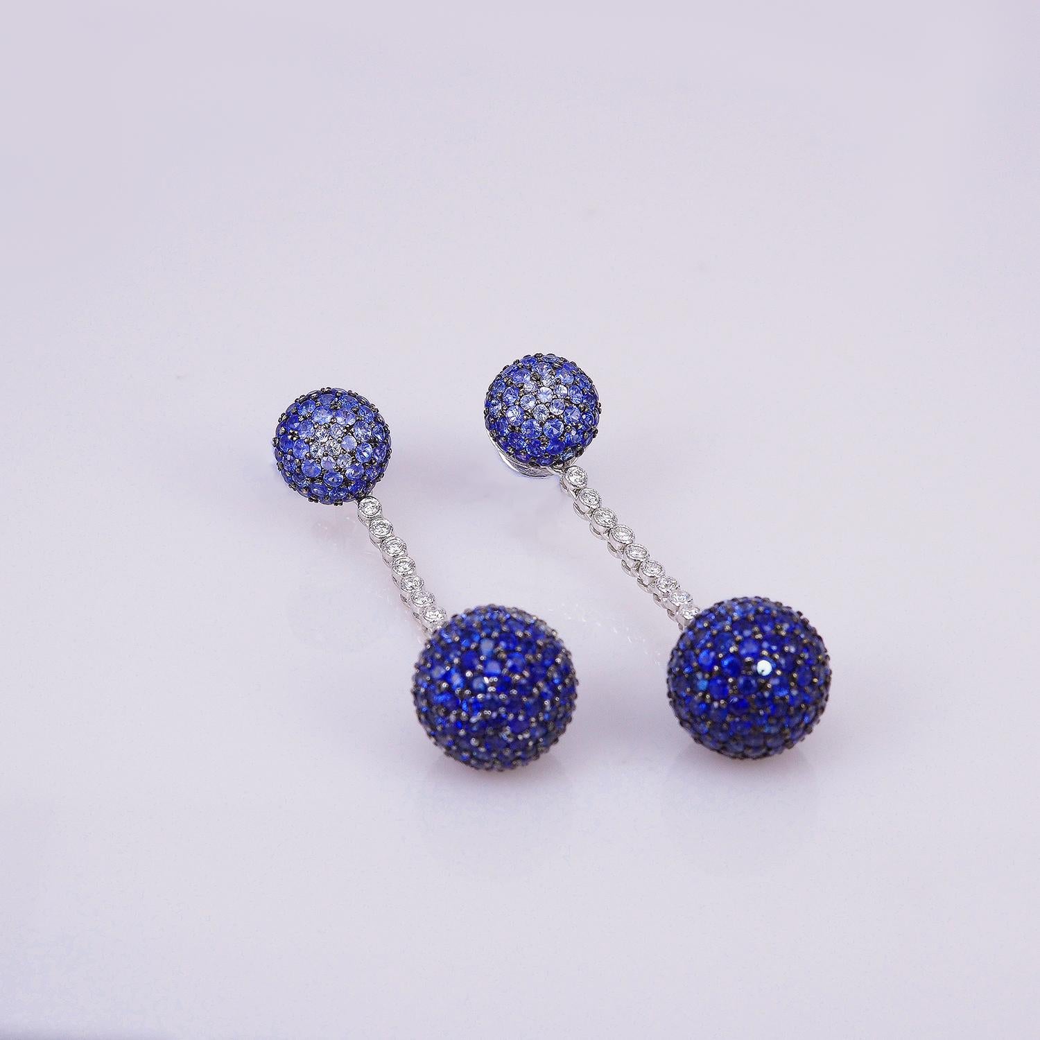 18 Karat White Gold Sapphire and Diamond Balls Earrings

2 Balls earrings made in 18k white Gold.It make in modern style .We shaded color of sapphire to show the powerful of color.This earrings can detachable so you can wear alone ball for day time