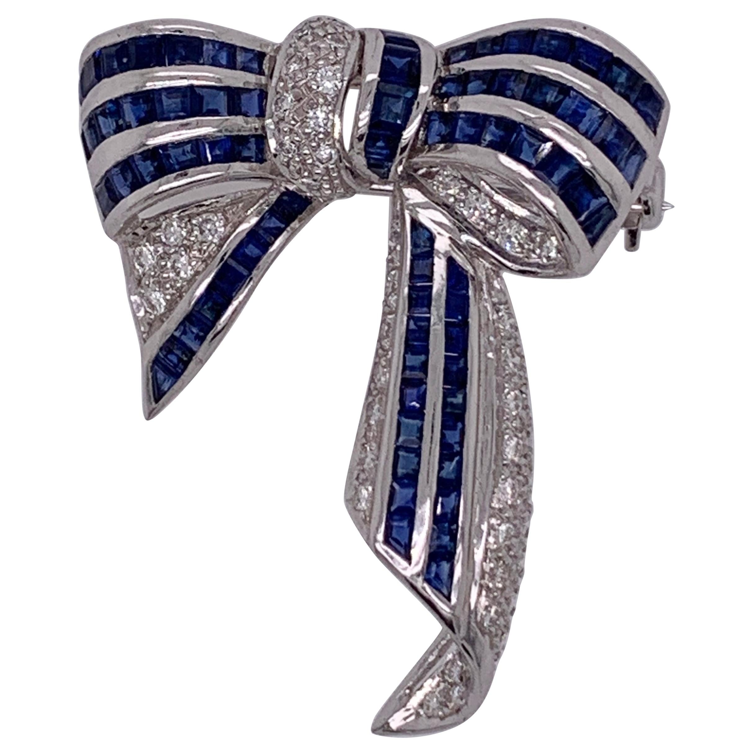 18 Karat White Gold Sapphire and Diamond Bow Pin 1.10 TDW For Sale