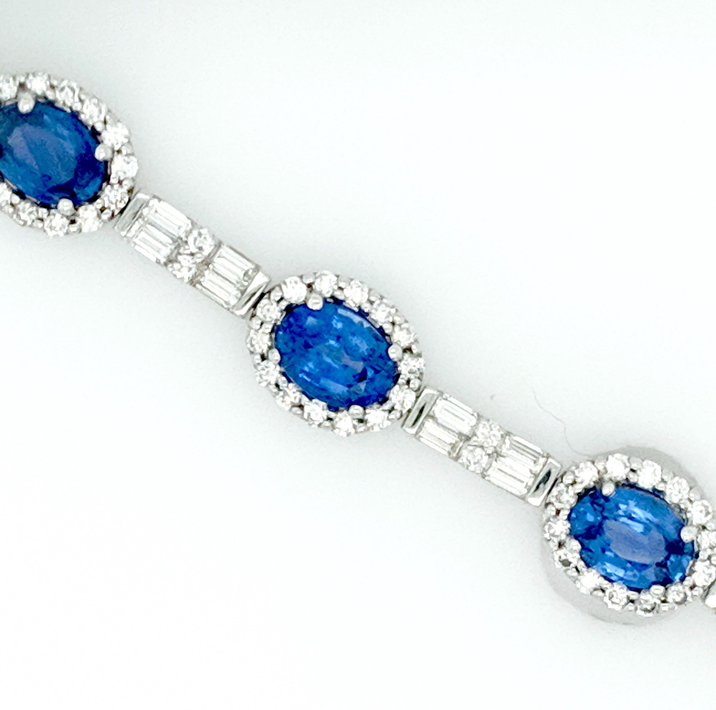 The Sapphire and Diamond bracelet is crafted in 18K white gold and features (9) oval fine color ceylon  sapphires weighing approximately 8.19cttw with 144 round diamonds weighing approximately 2.10cttw with a color of G/H and a clarity of SI1-2 and