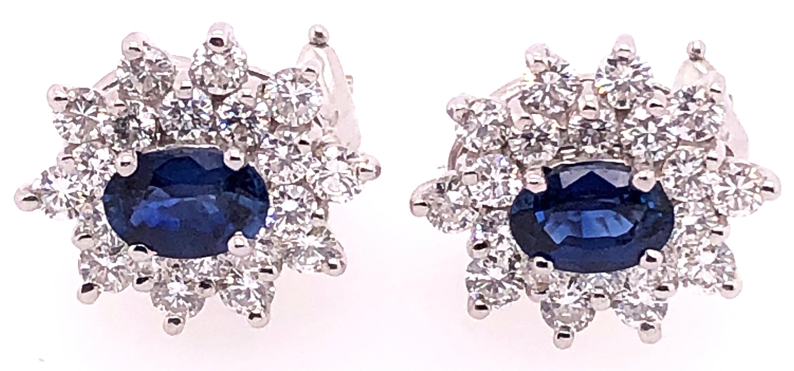 Oval Cut 18 Karat White Gold Sapphire and Diamond Cluster Earrings For Sale
