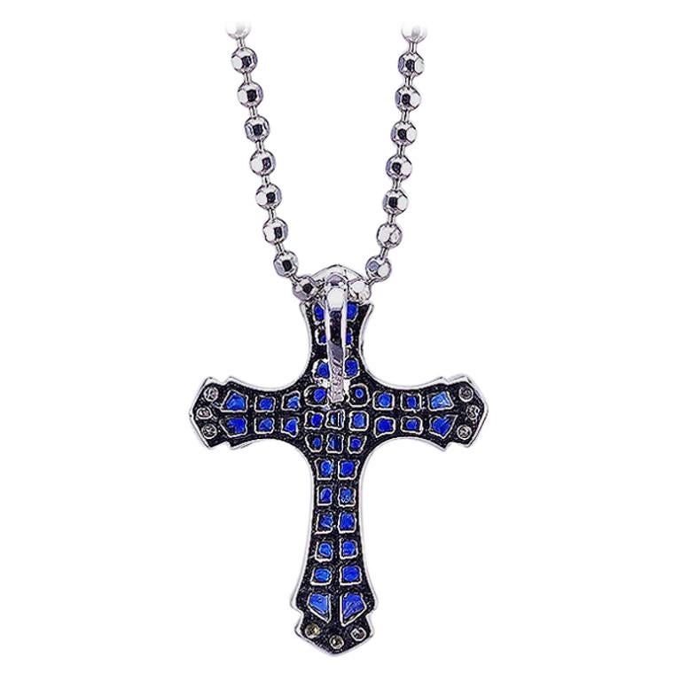 We design a very nice cross pendant .The technique  use invisible setting .We cut and groove very stone. This pendant is very nice style you can use in many occasion in day time and evening time for party.  Sapphire use 3.05 ct, Diamond 0.05 ct G VS