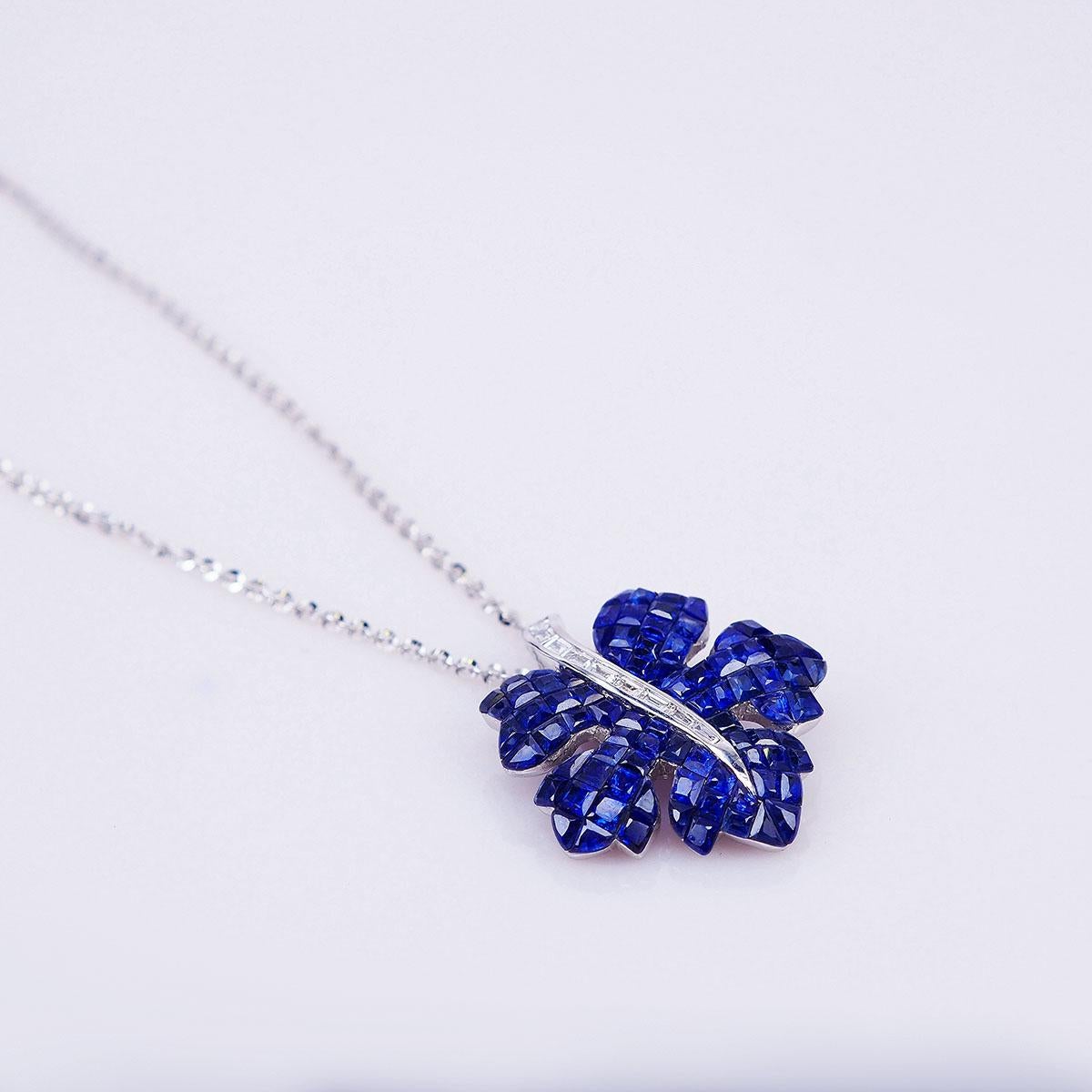 We design a very nice maple pendant .The technique  use invisible setting .We cut and groove very stone. This pendant is very nice style you can use in many occasion in day time and evening time for party.  Sapphire use 12.60 ct, Diamond 0.23 ct G