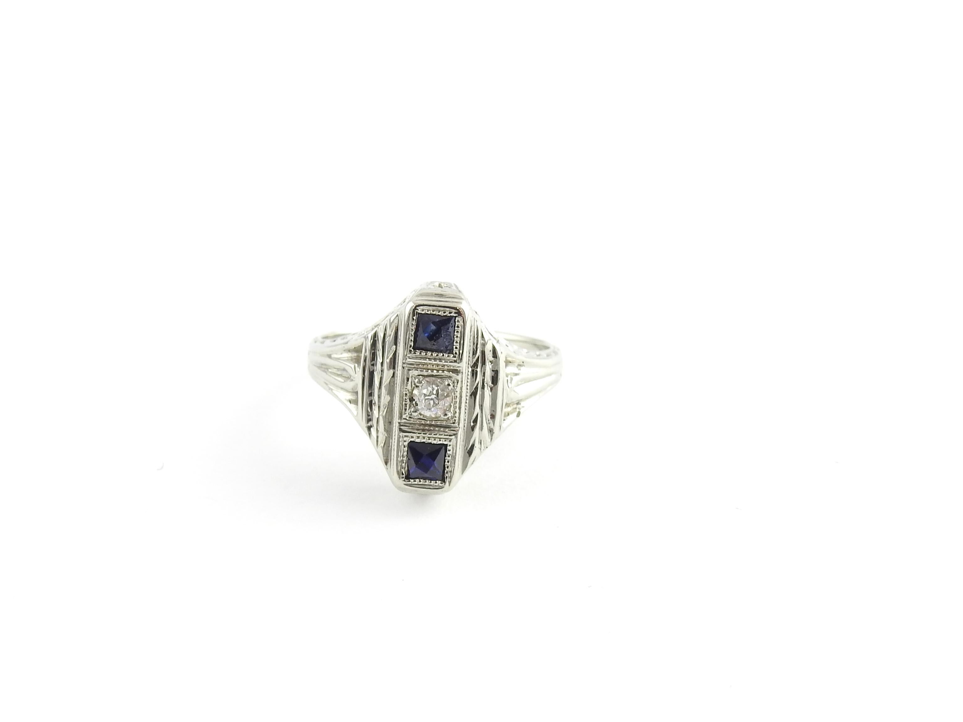 Vintage 18 Karat White Gold Genuine Sapphire and Diamond Ring Size 3.25

This stunning ring features one round European cut diamond and two genuine square sapphire set in beautifully detailed white gold filigree. Top of ring measures 13 mm x 10 mm.