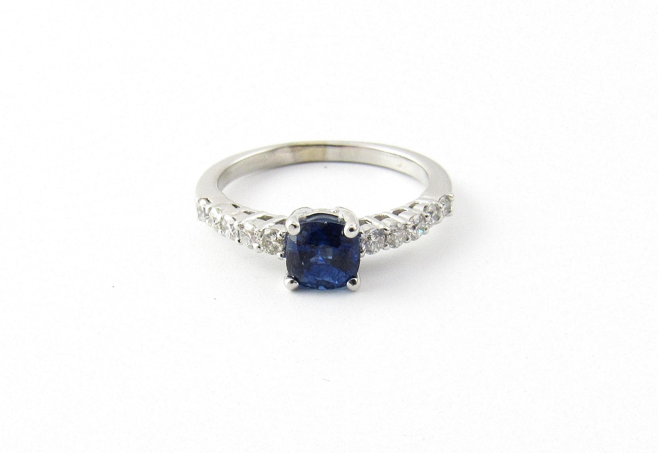 Vintage 18 Karat White Gold Sapphire and Diamond Ring Size 6.5-

This lovely ring features one round sapphire (5 mm) accented with ten round brilliant cut diamonds set in classic 18K white gold. Shank: 2 mm.

Approximate total diamond weight: .20