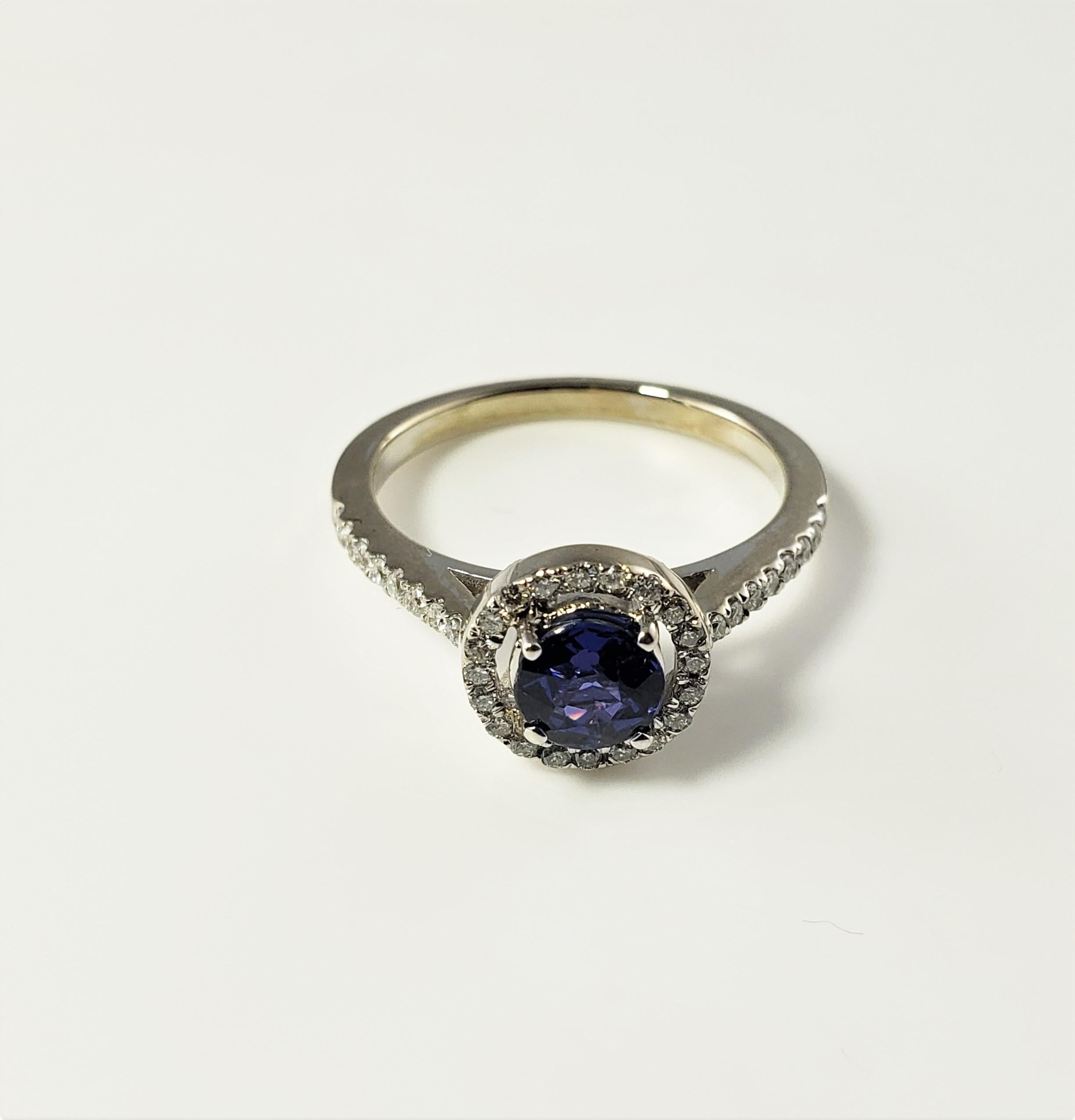 18 Karat White Gold Sapphire and Diamond Ring Size 6.75 GAI Certified-

This sparkling ring features one round sapphire surrounded by 34 round brilliant cut diamonds.  Shank:  2 mm.

Total sapphire weight:  .76 ct.

Sapphire clarity grade: 