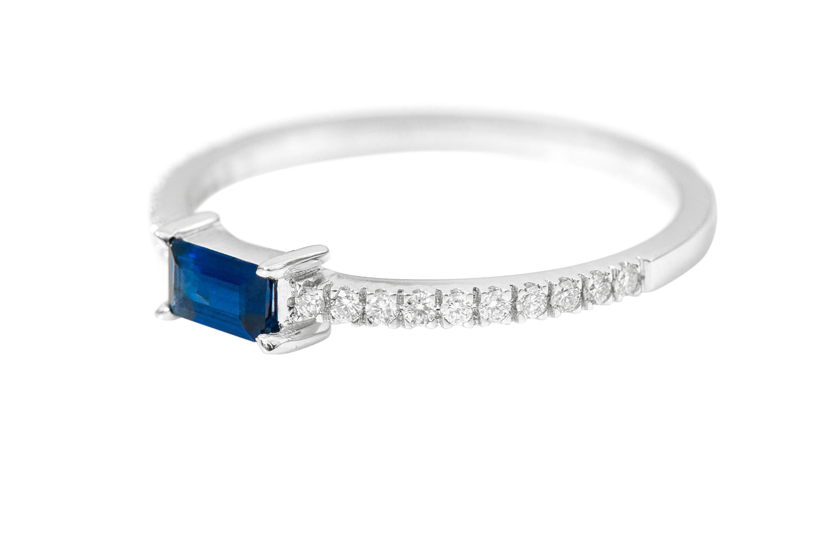 18 Karat White Gold Sapphire and Diamond Solitaire Band Ring

This phenomenal royal blue sapphire and diamond ring is gorgeous. The solitaire baguette-cut sapphire in eagle prong box setting in rose gold is perfect. The thin band of half pave-set