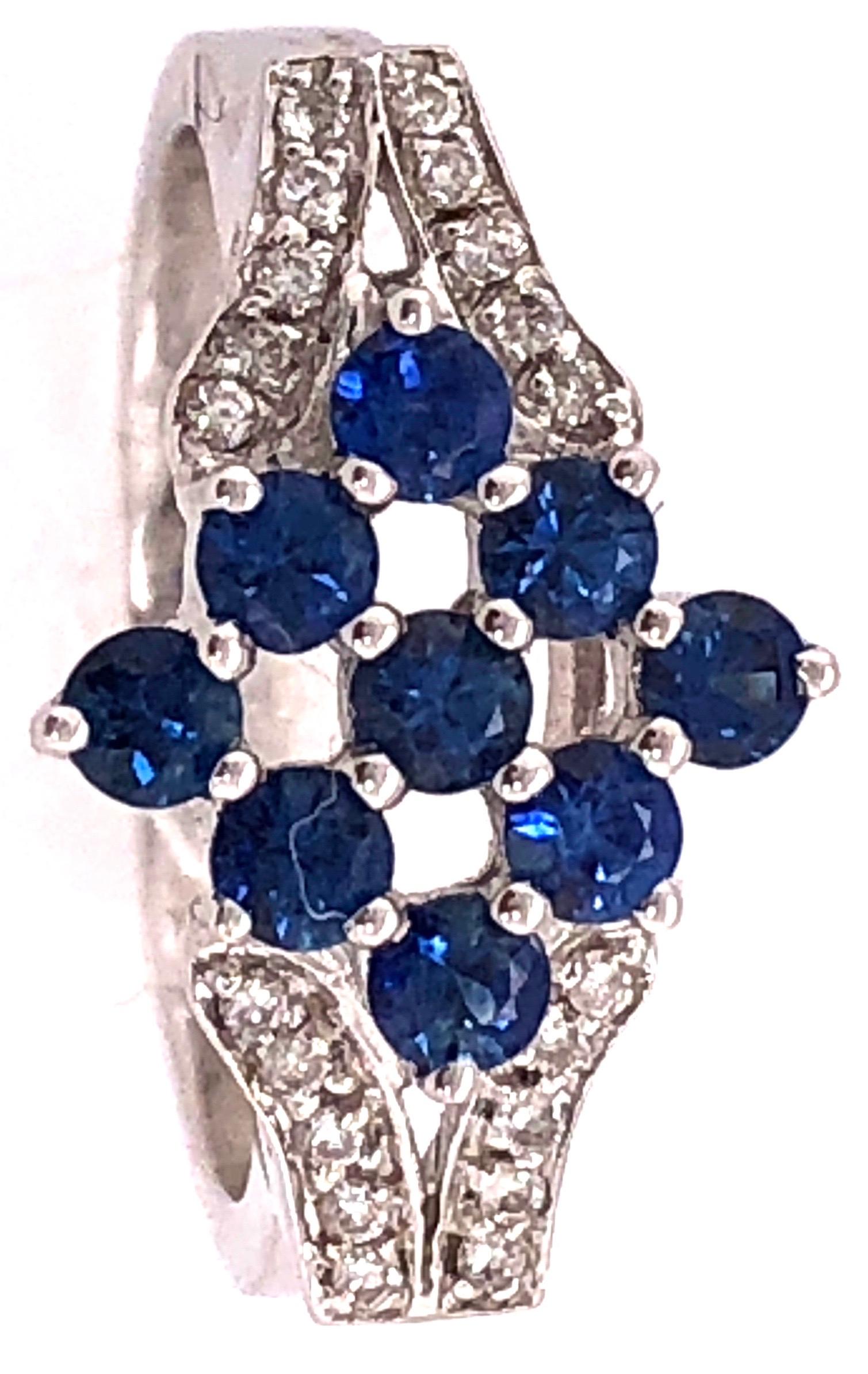 18 Karat White Gold Sapphire Cluster Fashion Ring with Diamond Accents 
0.11 Total Diamond Weight.
Size 6.5
5.26 grams total weight. 