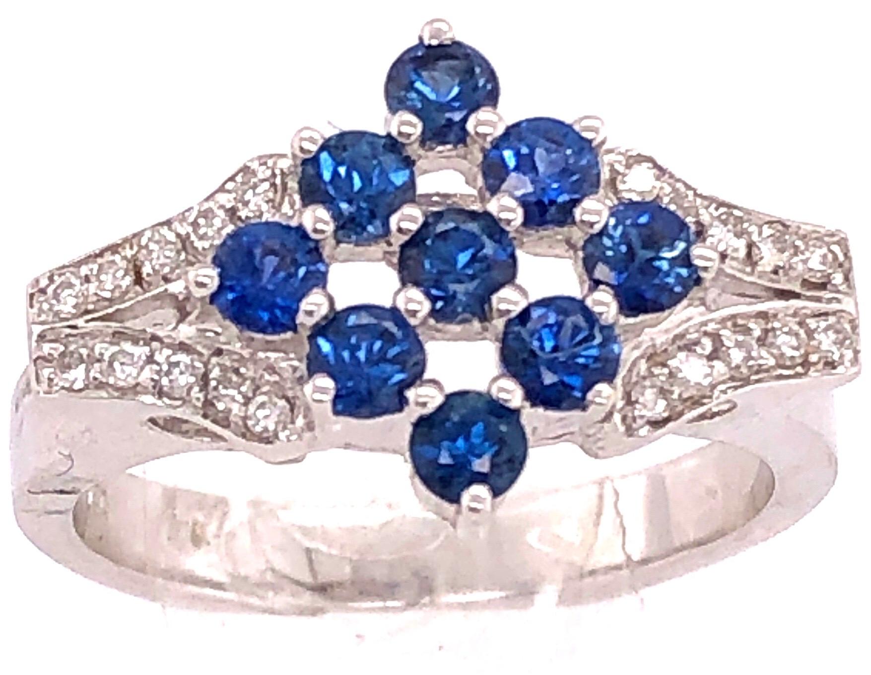 Modern 18 Karat White Gold Sapphire Cluster Fashion Ring with Diamond Accents 0.11 TDW For Sale