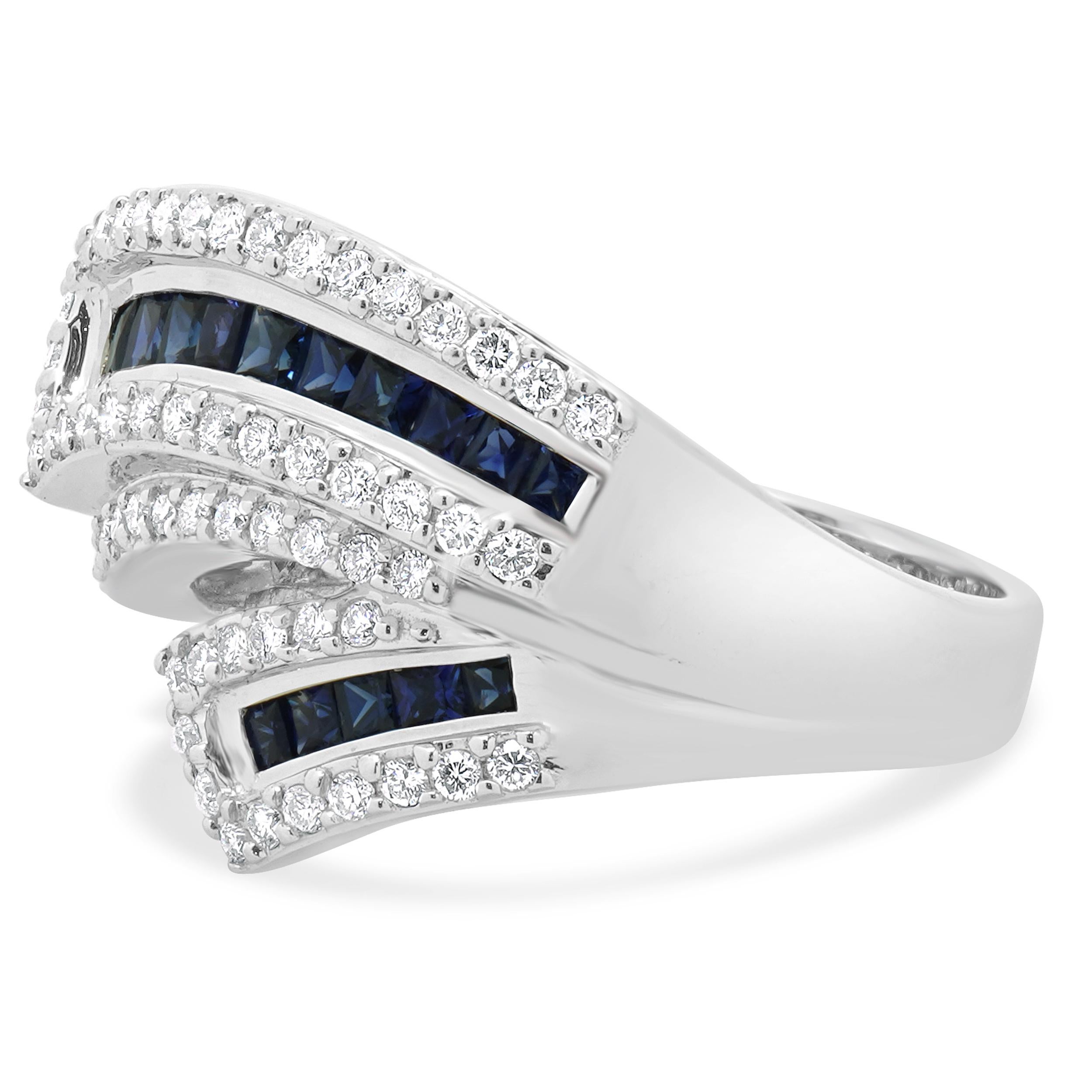 Diseñador: custom
Material: oro blanco de 18 quilates
Diamante: 66 talla brillante redonda = 0,59ctw
Color: G/H
Claridad: SI1
Zafiro 18 talla cuadrada = 1,20ctw
Dimensiones: la parte superior del anillo mide 16.3 mm de ancho
Tamaño: 7.5
Peso: 9.06