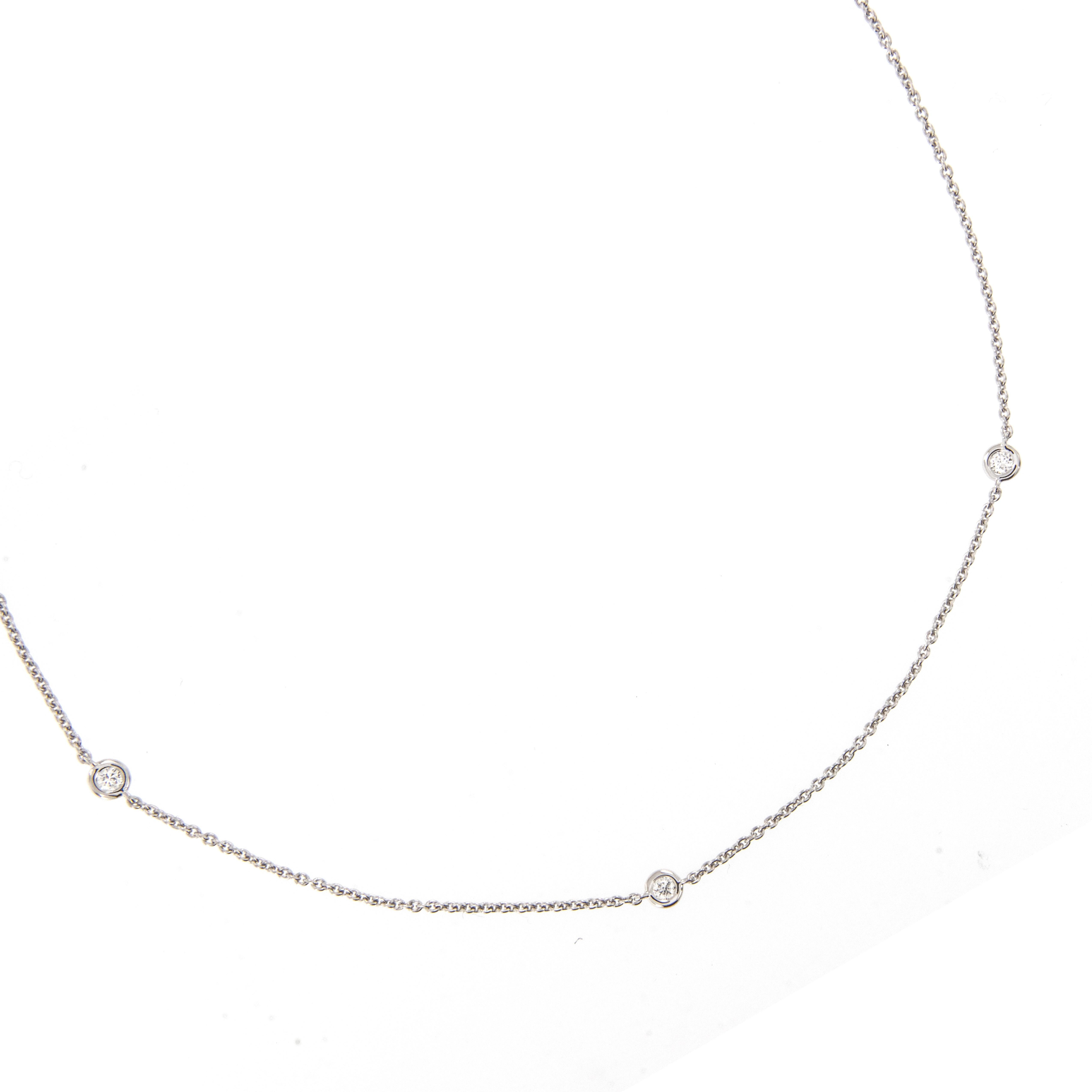 Rich 18 karat white gold with six fine quality diamonds = 0.37 Cttw (VS clarity, G-H color) this station necklace stands the test of time! You can wear every day with jeans and a t-shirt and looks fabulous with other necklaces for a stylish layered