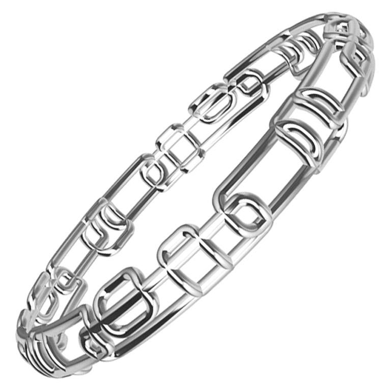 18 Karat White Gold Soft Rectangle Bangle Bracelet. Tiffany designer, Thomas Kurilla continues the Water and Light series with thin stackable bangles 3/8 inch or 9mm wide. Airy and light pierced designs with soft corners. Overlapping soft curved