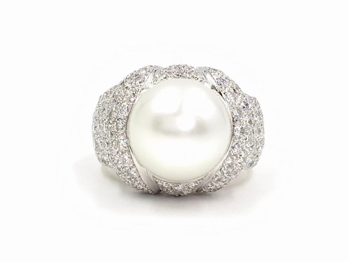 A beautiful and timeless statement ring featuring a 12.25mm natural white south sea pearl and 3.49 carats of white round brilliant diamonds. White diamonds are approximately F-G color, VS2 clarity and are perfectly pavé set. Ring measures 17mm at