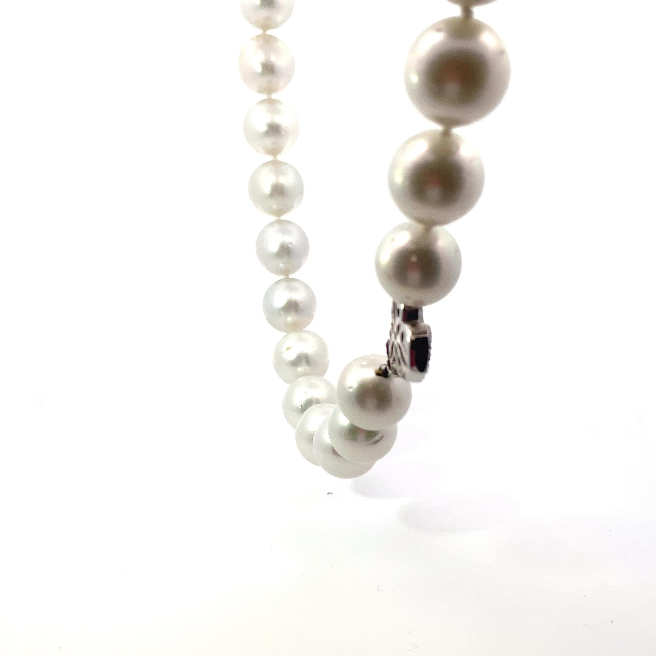 18 Karat White Gold South sea Pearls and Diamond Necklace  
There are 25 South Sea Pearls measuring approximately  14 -18 millimeters.
with a paved diamond clasp.
55 round brilliant cut diamonds weighing approximately 1.00 carats.  
Color range is