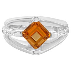 Anello con granato spessartite e diamante in oro bianco 18 carati