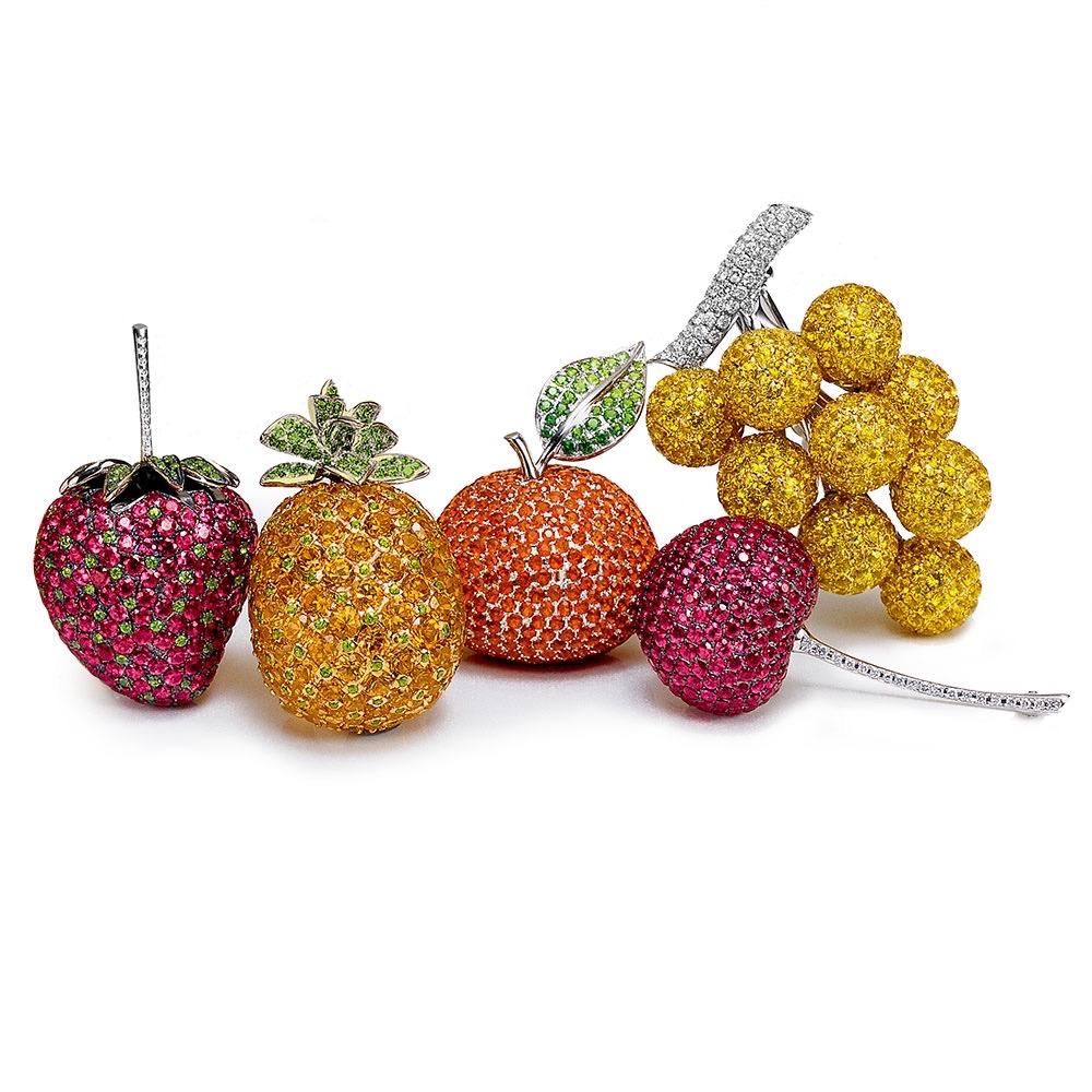 Cellini Jewelers NYC exclusive....sweet, sweet, strawberry.
This lovely brooch is set with 171 round Rubies, & 135 round Tsavorites  for the fruit, 10 round Diamonds are set in the stem. The strawberry measures  1.75