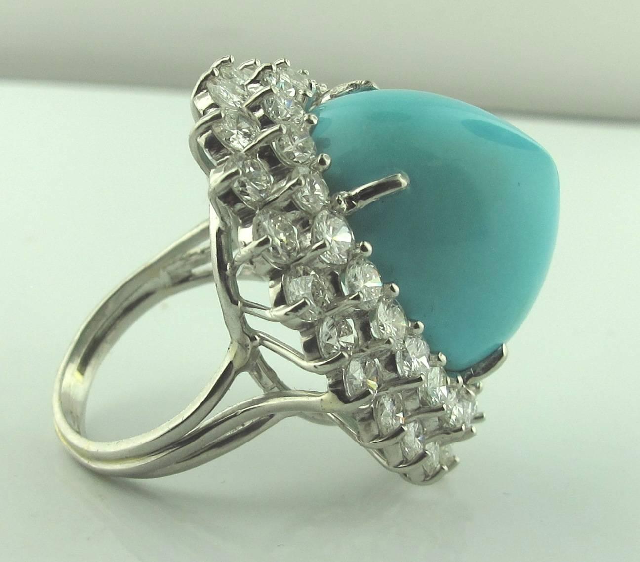 18 Karat White Gold Sugarloaf Persian Turquoise with 2 rows of round brilliant diamonds with a total diamond weight of approximately 5.00 carats - G-H color, VS clarity.
Exceptional quality Persian turquoise.   Ring Size:  6.5