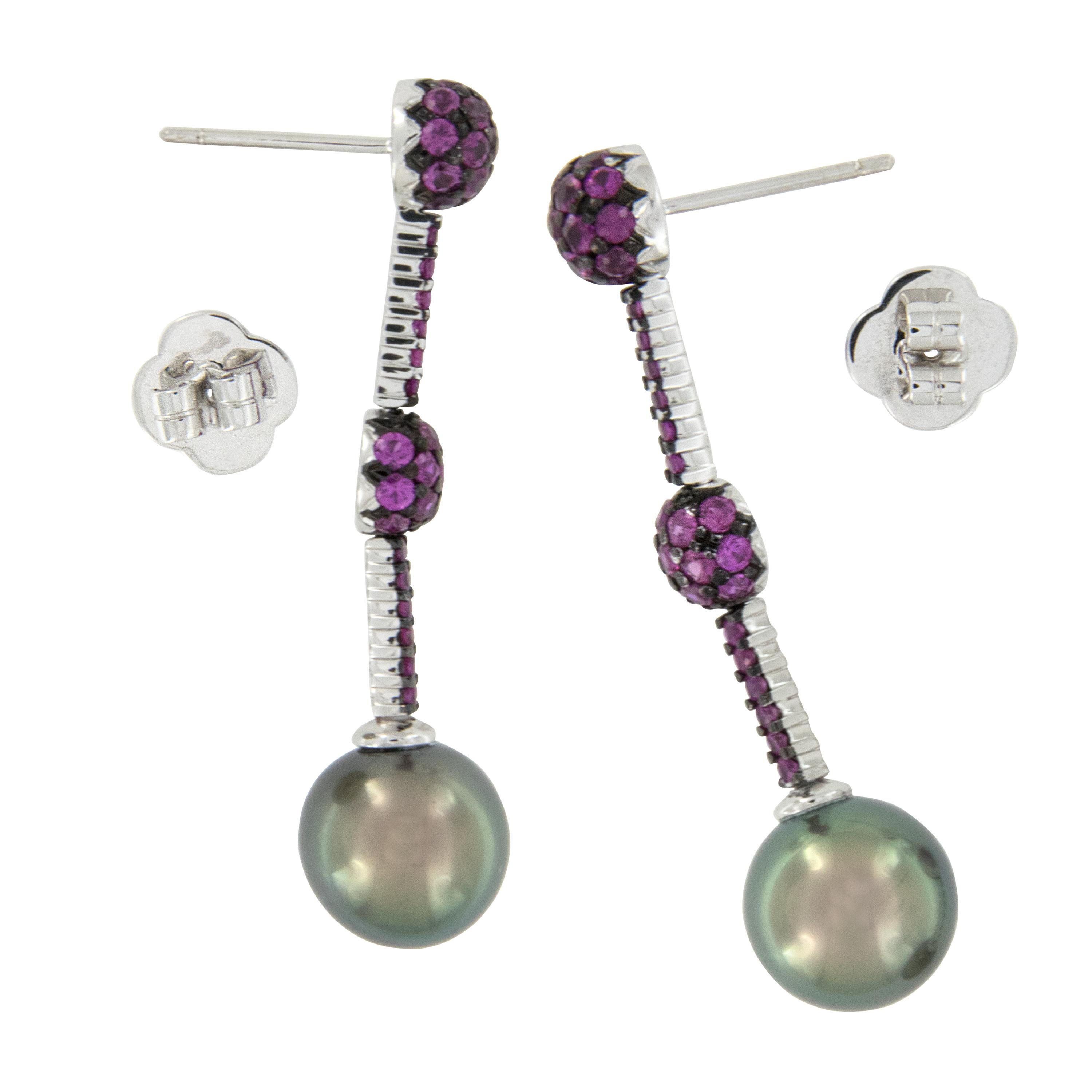 Hot! Hot! Hot! These stunning drop earrings have Tahitian pearls with rainbow like overtones that are further accented with hot pink sapphires = 2.47 Cttw.  Crafted in 18 karat white gold with posts & friction backs for security of wear!
Tahitian