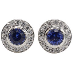 18 Karat White Gold Tanzanite and Diamond Halo Stud Earrings