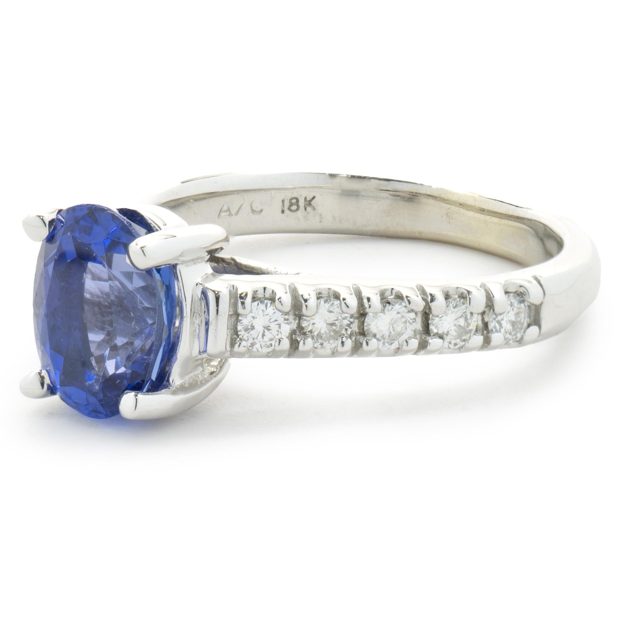 Designer: custom design
Material: 18K white gold
Diamond: 10 round brilliant cut = 0.20cttw
Color: G
Clarity: VS
Tanzanite: 1 oval cut = 1.25ct
Dimensions: ring top measures 8mm wide
Ring Size: 5.5 (please allow two extra shipping days for sizing