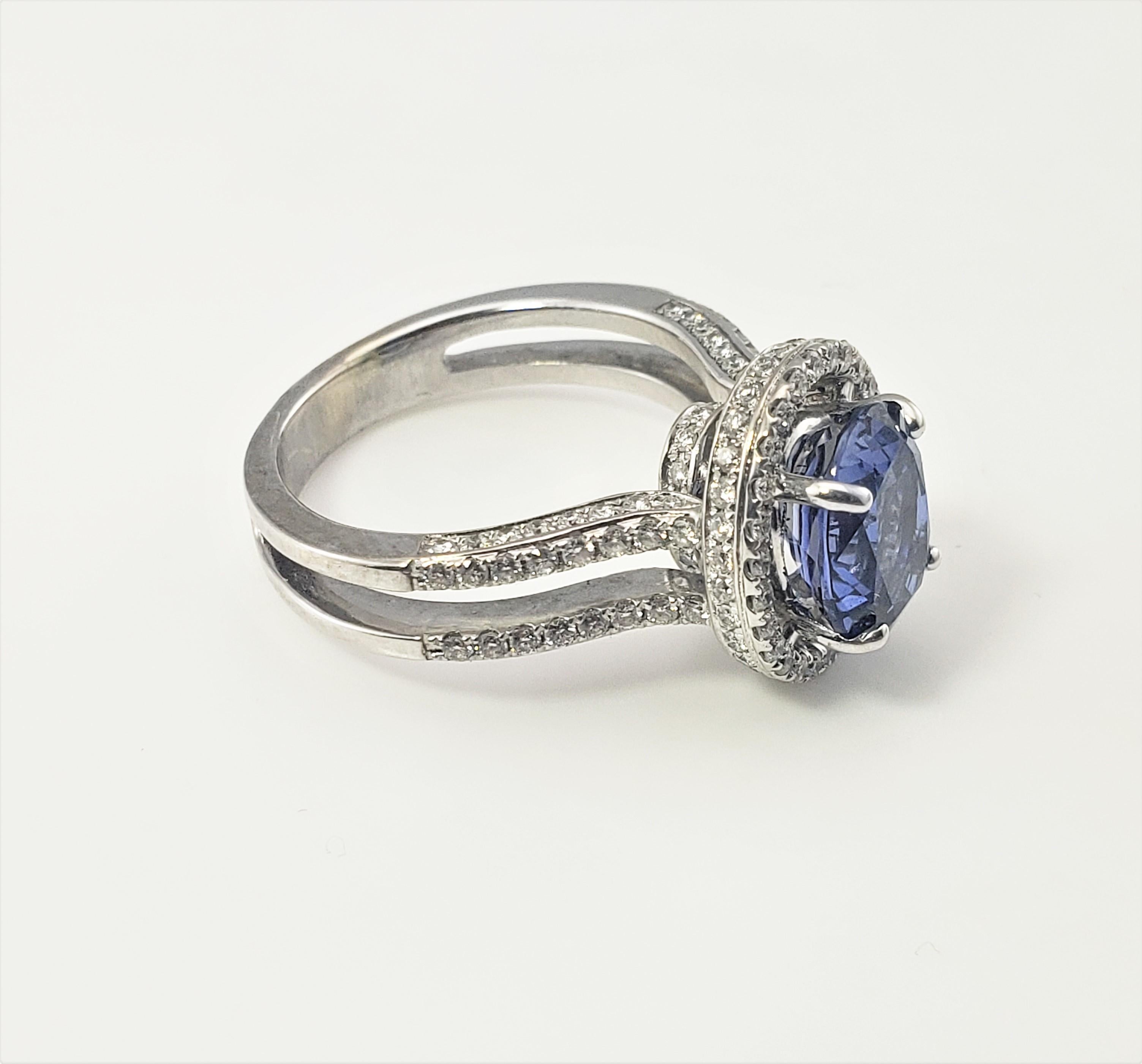 18 Karat White Gold Tanzanite and Diamond Ring Size 7.5 GAI Certified-

This stunning ring features one oval tanzanite (11 mm x 8 mm) surrounded by 149 round brilliant cut diamonds set in classic 18K white gold.  Top of ring measures 15 mm x 13 mm. 