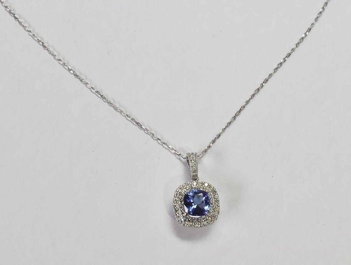This stunning necklace features AAA Natural Cushion Cut Tanzanite and 0.35 ct round cut diamond. This pendant necklace is in solid white gold. This Necklace is perfect for everyday use and can be a lovely gift for any occasion! Handcrafted by master