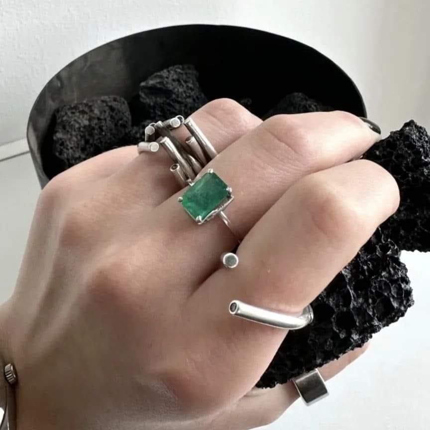 This contemporary ring is made of 18 karat white gold with natural green emerald, 4,9 carats. It belongs to Tea collection, which was featured in Vogue UA. It has a tiny tea twig on the side of the gem to have an unusual but still classy look of the