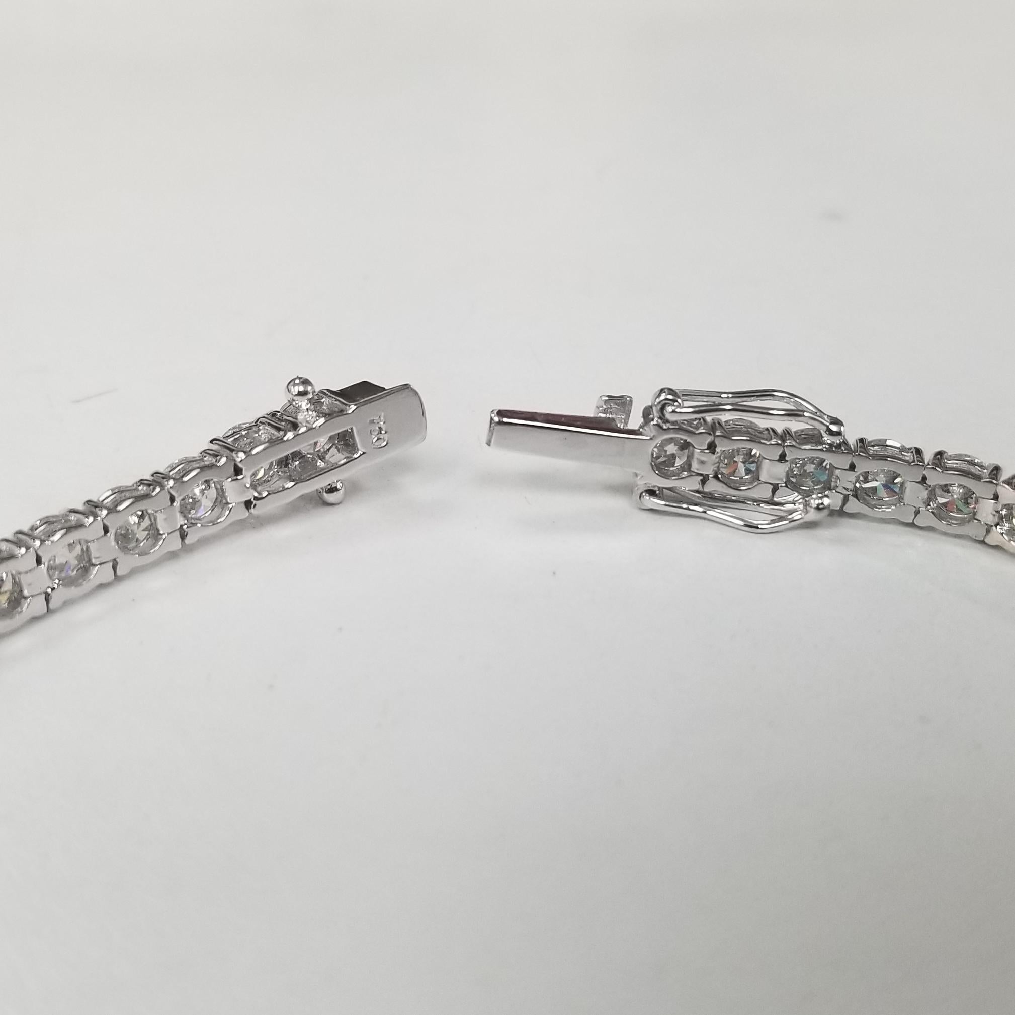 This is very beautiful 18k white gold custom made tennis bracelet with 45 round diamonds color F-G and clarity SI1 weighing 9.35cts. very fine quality diamonds, bracelet measures 7 inches with clasp and safety.
Specifications:
    main stone: ROUND
