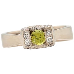 18 Karat White Gold Tension Set Peridot and Diamond Horseshoe Ring