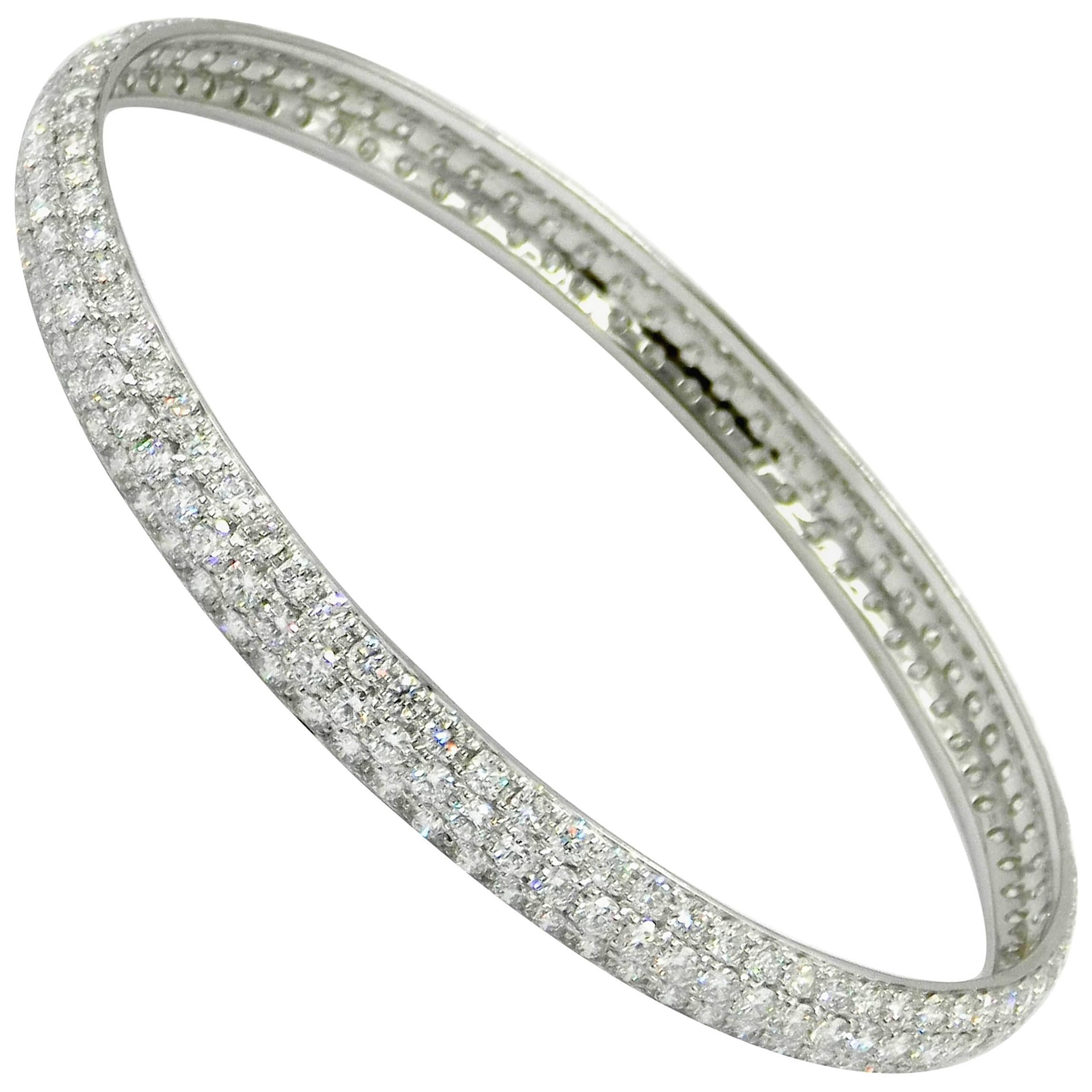 18KT White Gold Three Rows of Pavè  Diamonds BRACELET 
Perfectly Round Bangle Slip On - Inside Diameter  MM  65 
18kt GOLD  : 15,30
WHITE  DIAMONDS total ct : 9.7
The black diamonds version is also available for a perfect set of two.