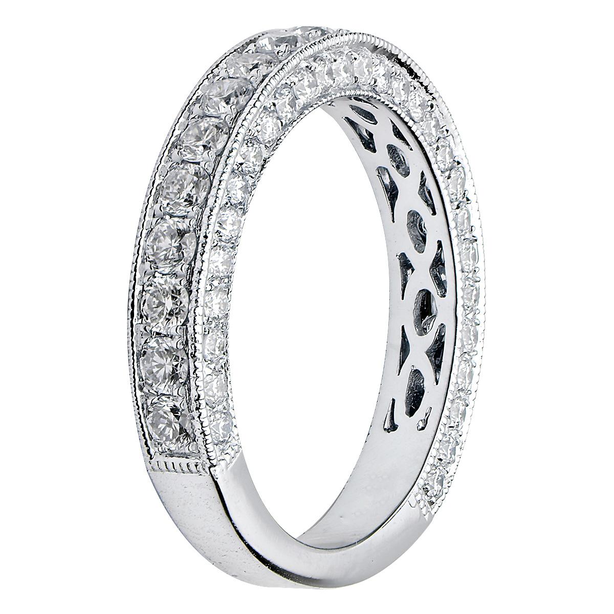 This beautiful band adds to a popular classic. There are 77 round VS2, G color diamonds totaling 1.07ct that are set 3/4 of the way around the band. The diamonds are channel set in the center as well as on the top and bottom to add sparkle from