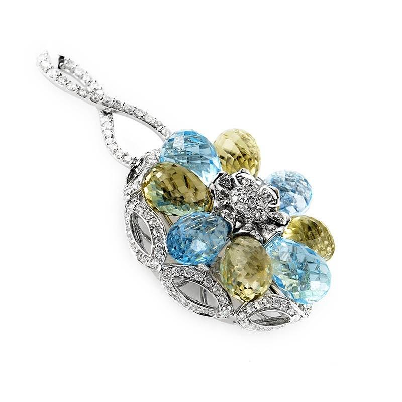 This chainless pendant is lovely and feminine. It is made of 18K white gold and boasts a flower shaped motif comprised of topaz and ~1ct of citrine. Lastly, the remainder of the pendant is accented with ~2.50ct of diamonds.

