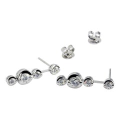 18 Karat White Gold Trio Plus One Diamond Drop Earrings