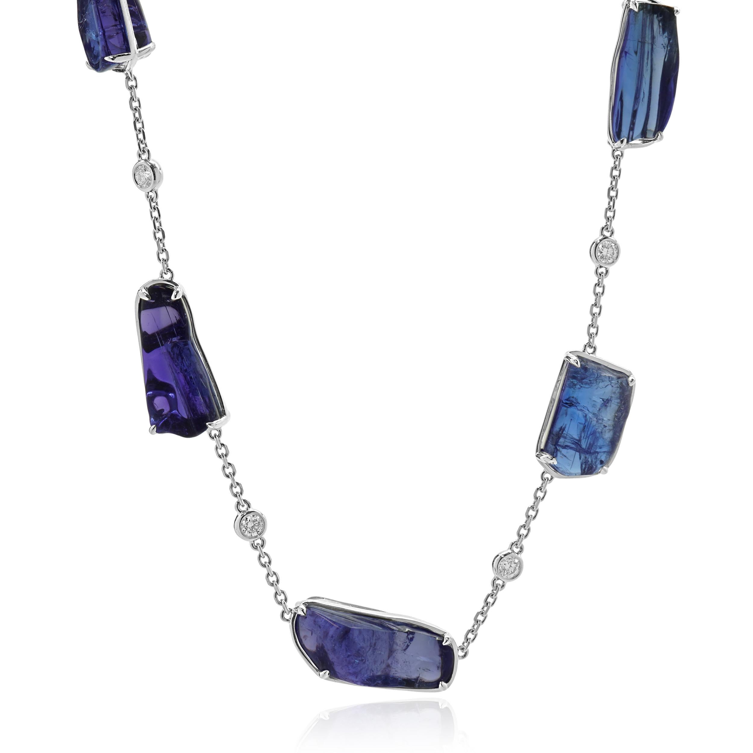 Designer: custom
Material: 18K white gold
Tanzanite = 111.85cttw
Diamond: 12 round brilliant cut = 1.13cttw
Color: G
Clarity: VS2
Weight: 35.34 grams
