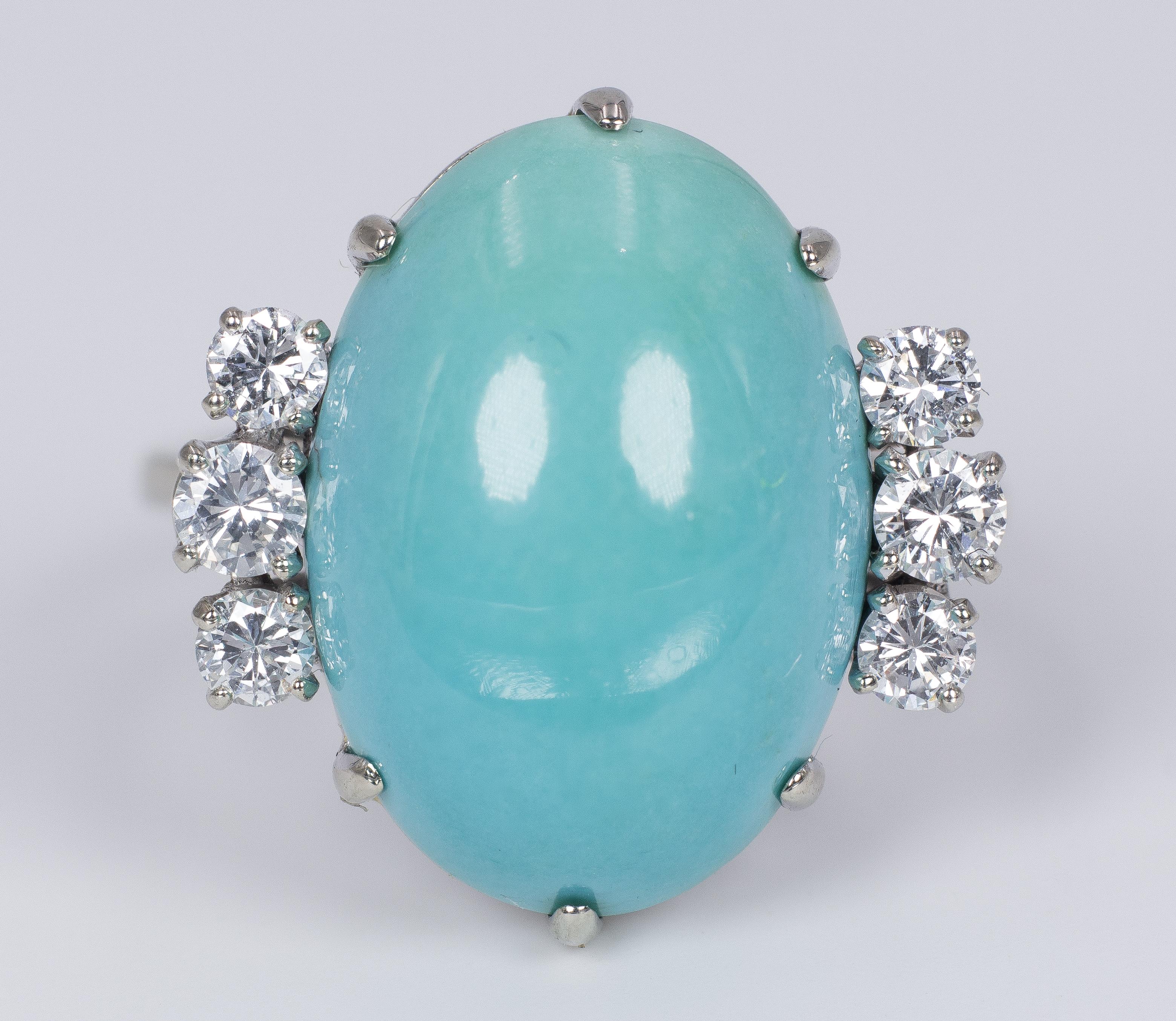 This modern ring, crafted in 18K white gold throughout, features a beautiful oval turquoise, flanked on either side by three round cut diamonds, totalling 0.50ct. 

MATERIALS
18K white gold, central turquoise and six round cut diamonds (totalling
