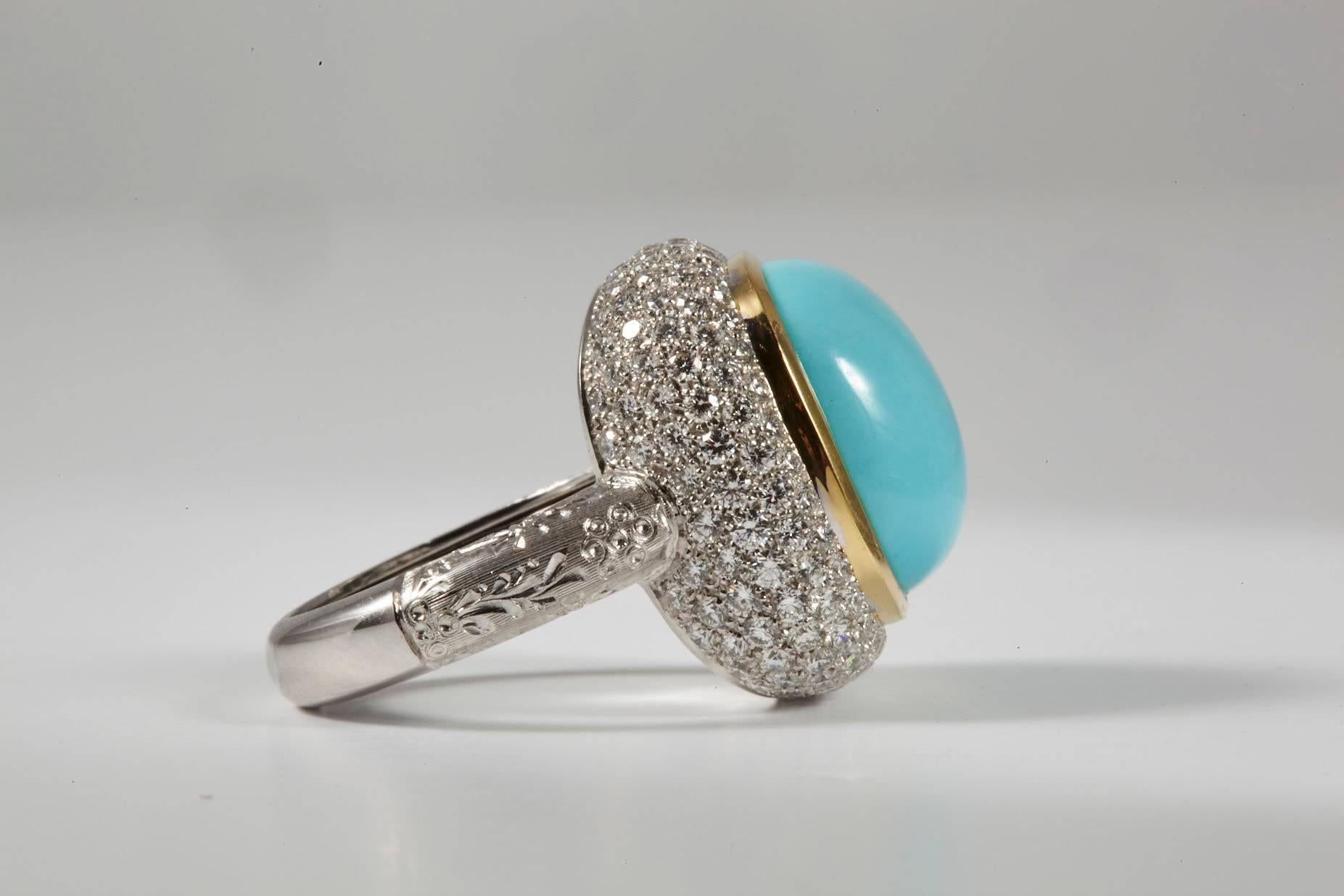 18 Karat White Gold with a trim of 18K yellow gold Turquoise and Diamond Cocktail Ring, Sleeping beauty square cabochon Turquoise 13.75ct  surrounded by layers of pave diamonds. 
A contemporary dome cocktail ring, the Turquoise is high quality