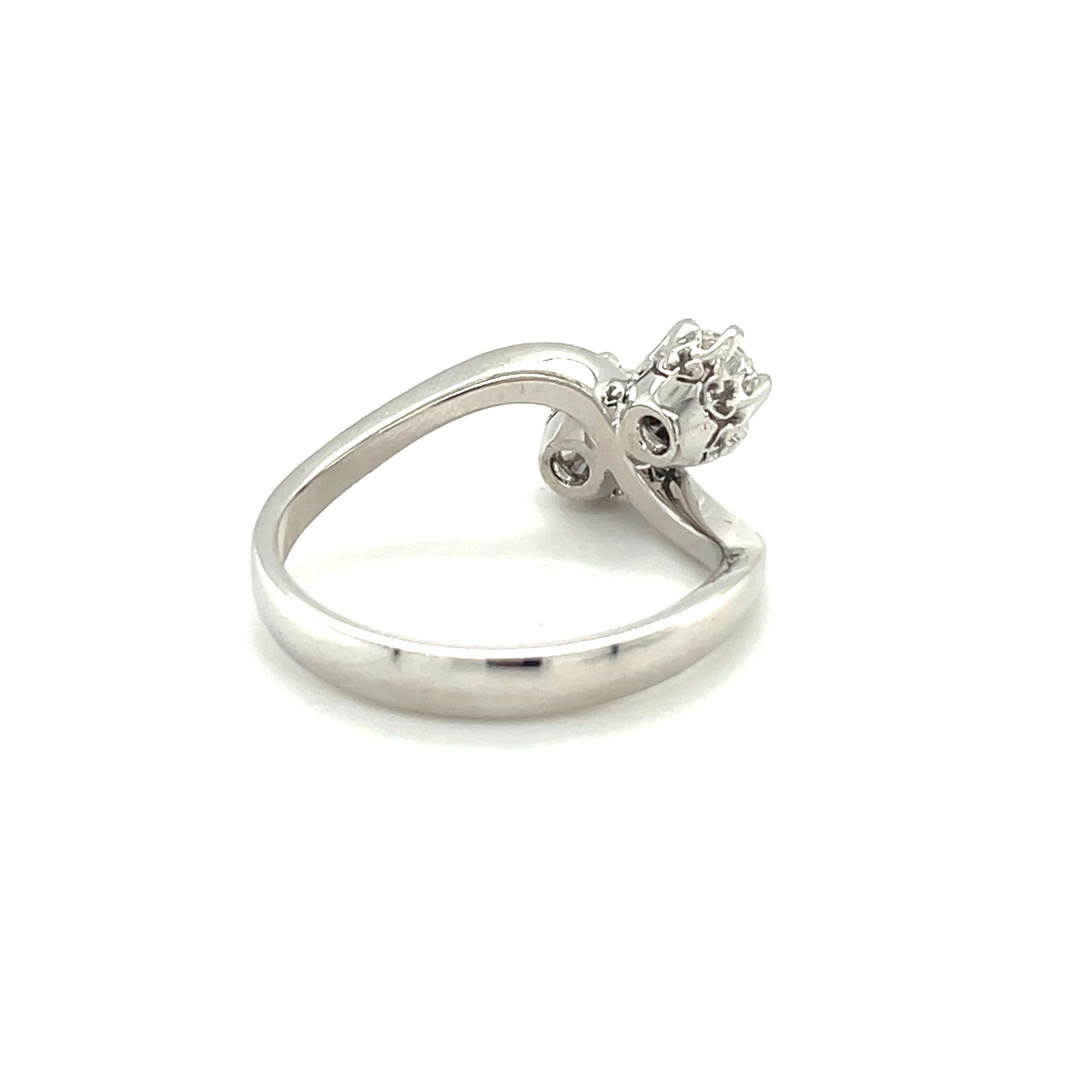 18K white gold engagement two stone ring is from ANNIVERSARY Collection. This ring is made of 2 natural white round diamond in G color and VS clarity in total of 0.68 Carat, as You & Me forever. Total metal weight is 4.36gr. The ring size is 55.1mm/
