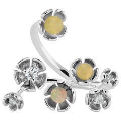 18 Karat White Gold Vine Ring with Opal and Diamond Accent 18 Karat White Gold Vine Ring with Opal and Diamond Accent