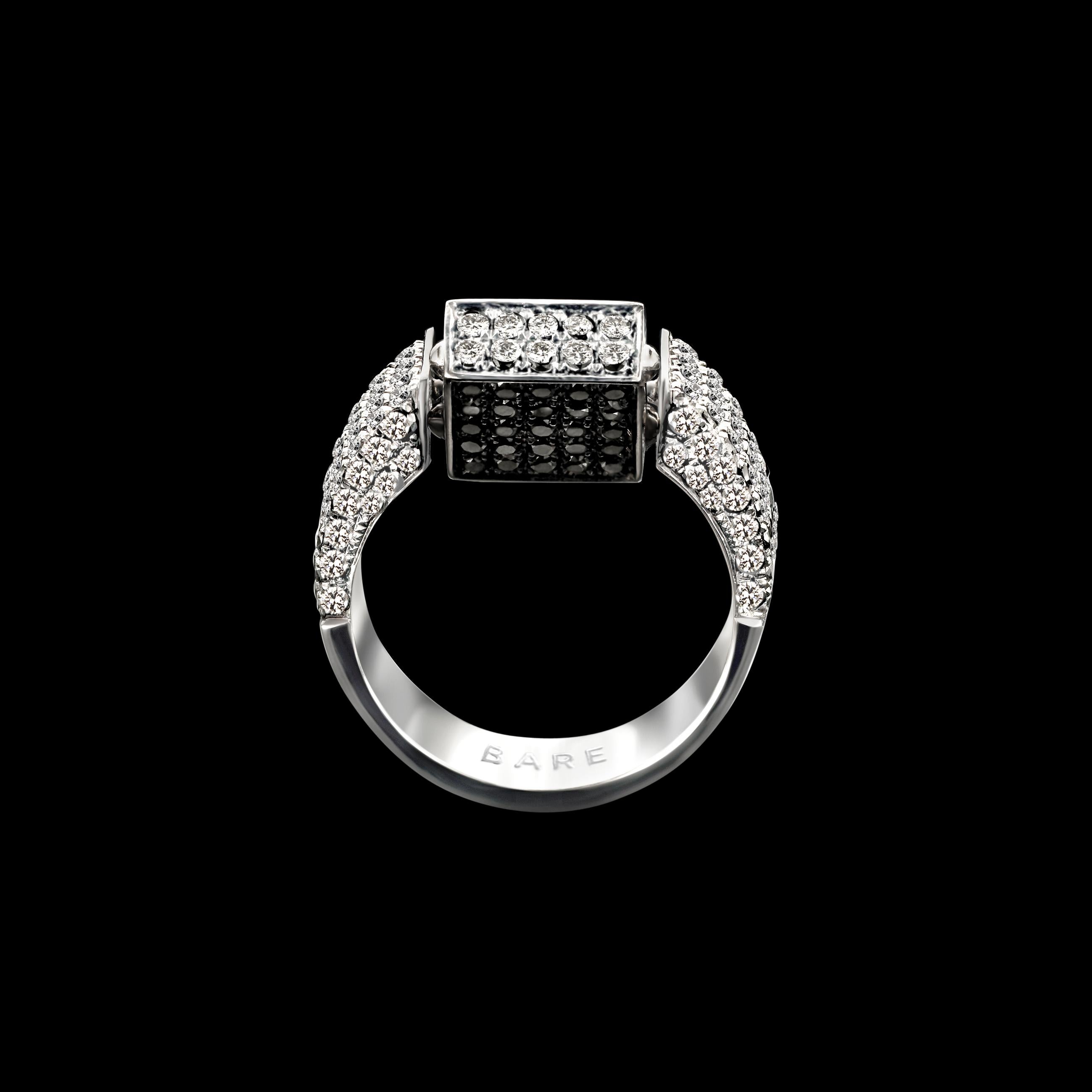 This square signet-inspired ring is expertly crafted by hand from 18-karat white gold, while the top and side are bedecked with an array of 2.95ct white and 0.32ct black diamonds.
Certified by International Gemological Institute Antwerp.
This ring